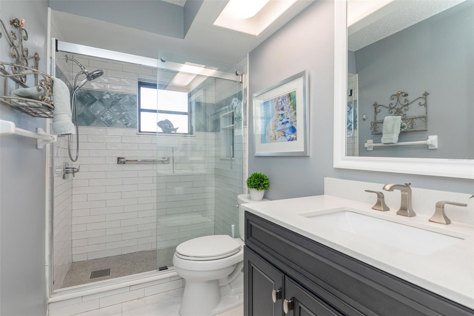 A special renovation of the hall bathroom with hand made Italian tile shower, sturdy glass doors & new fixtures~