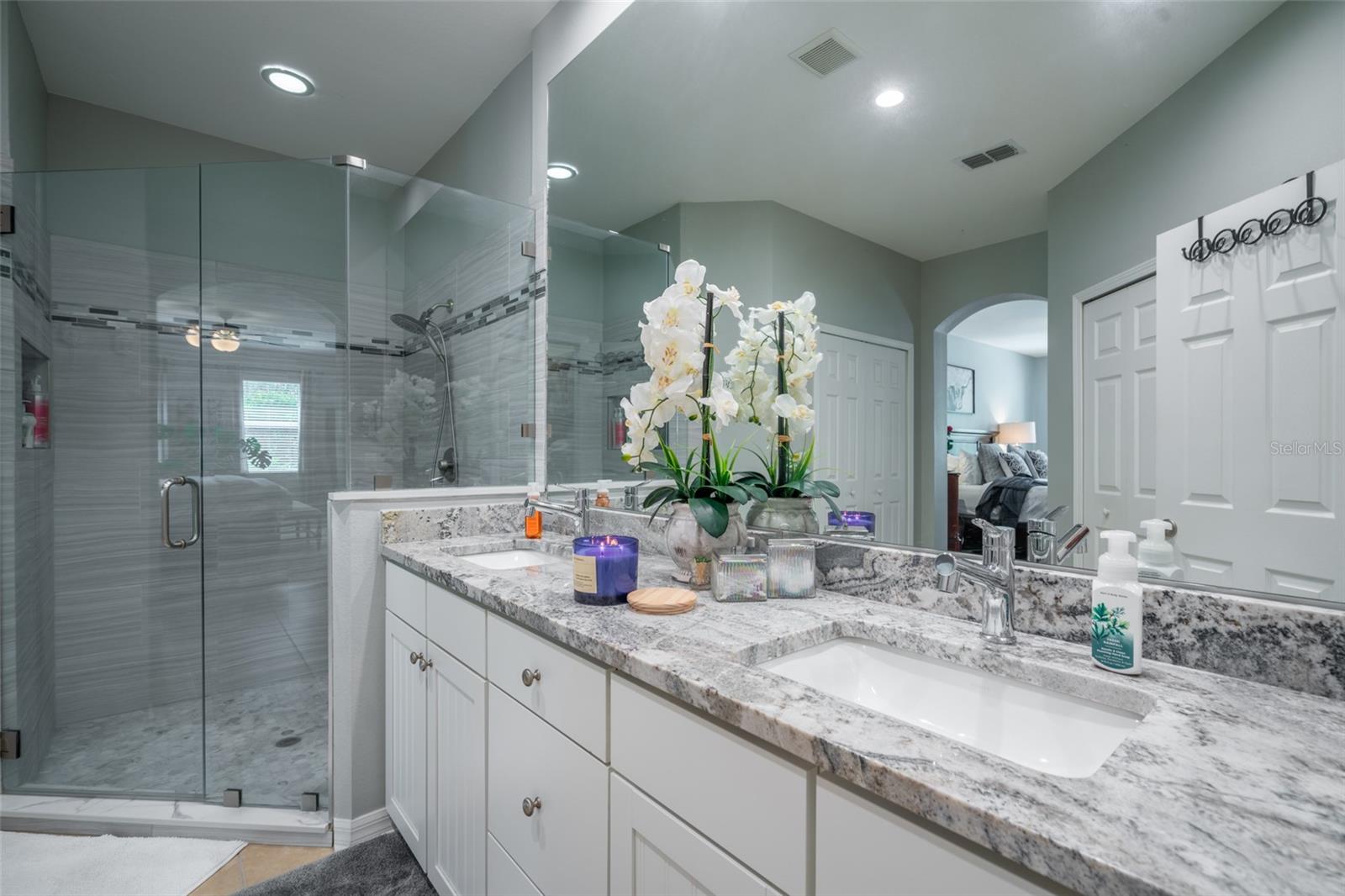 Primary bath recently updated with granite counter tops & all new tile in shower.
