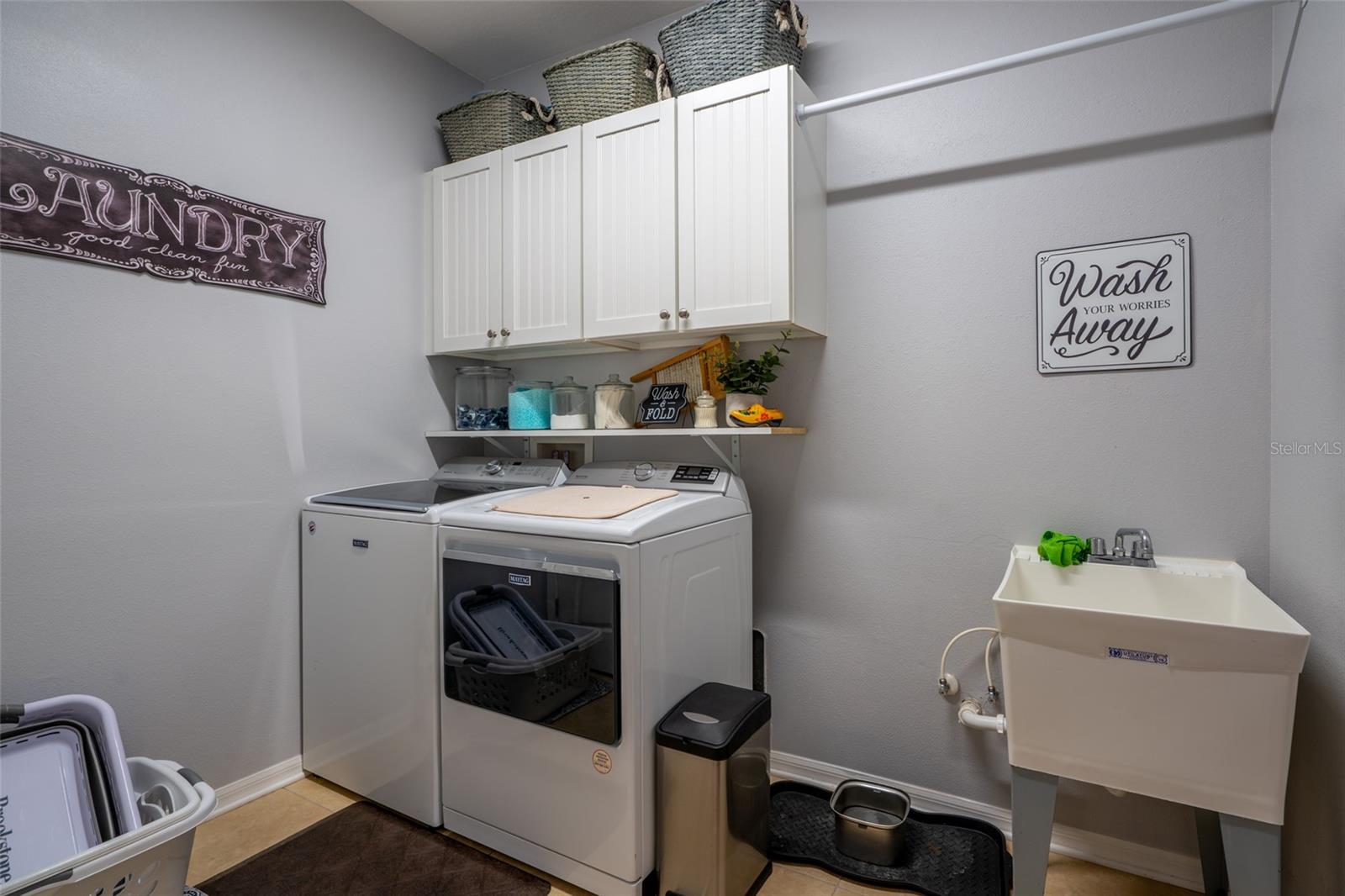 Laundry room w/utility sink located on 1st floor.