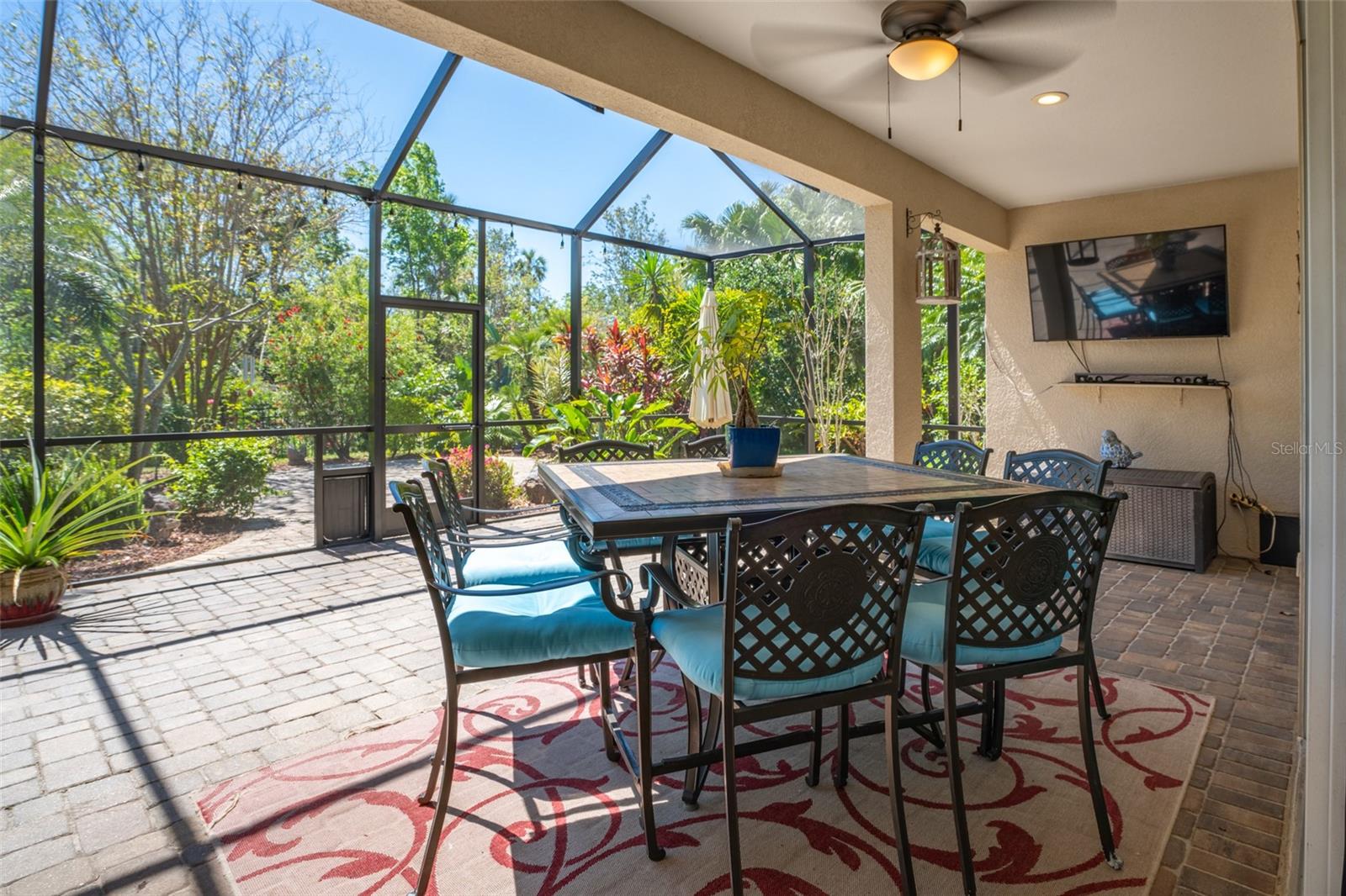 Fully screened in lanai offers plenty of outdoor seating.