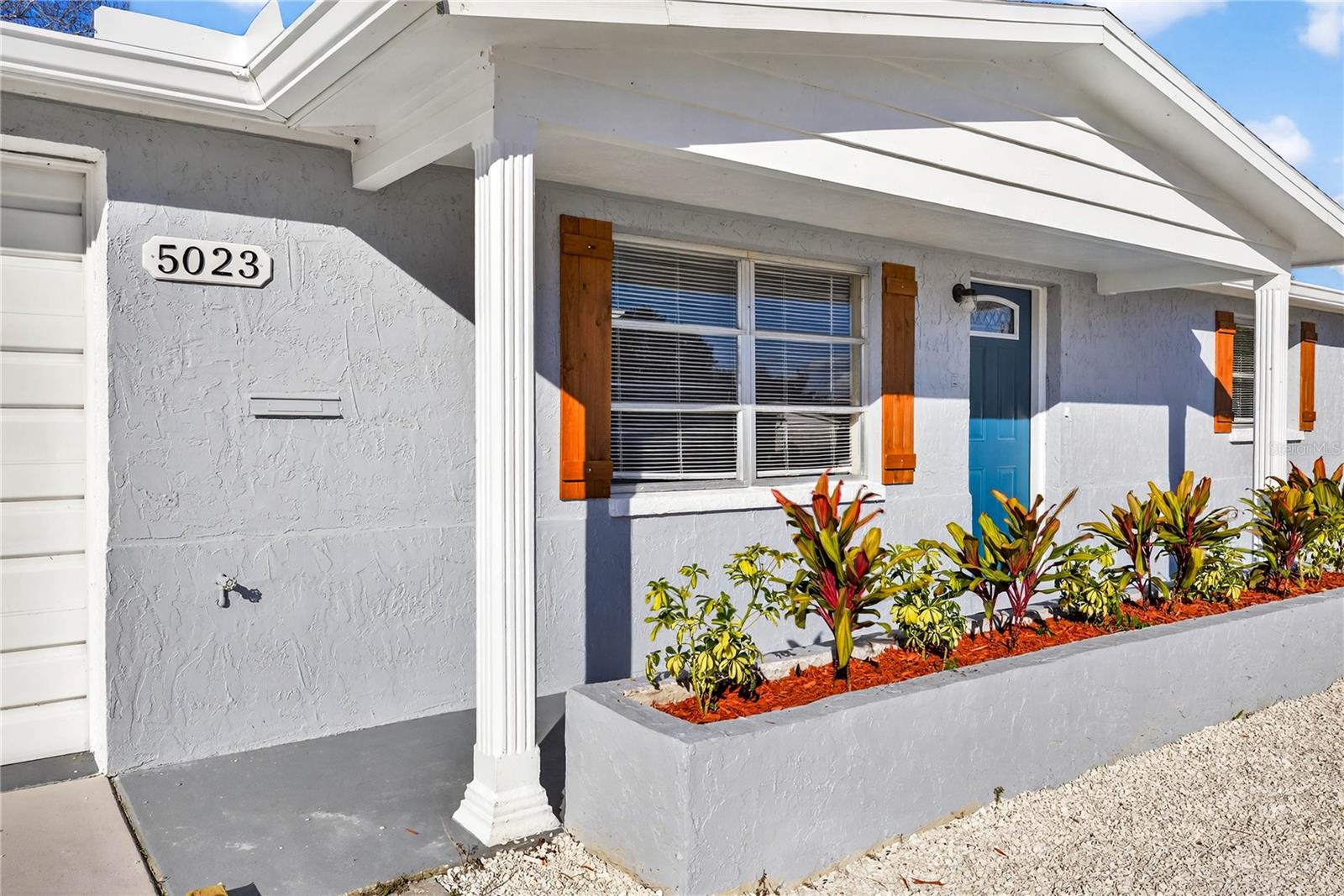 FRONT DOOR AND FRESH LANDSCAPING