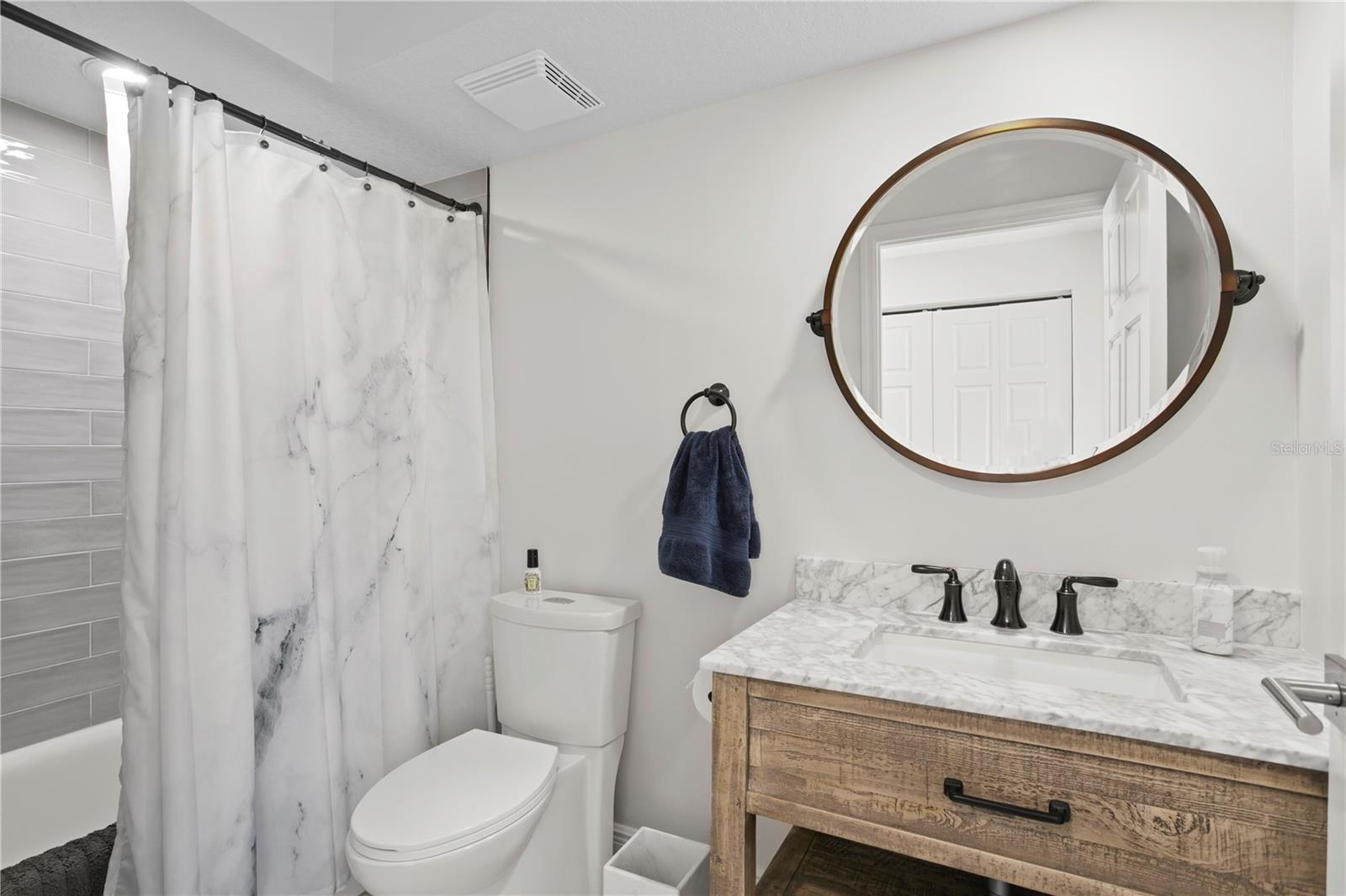 The nicely updated second full bathroom