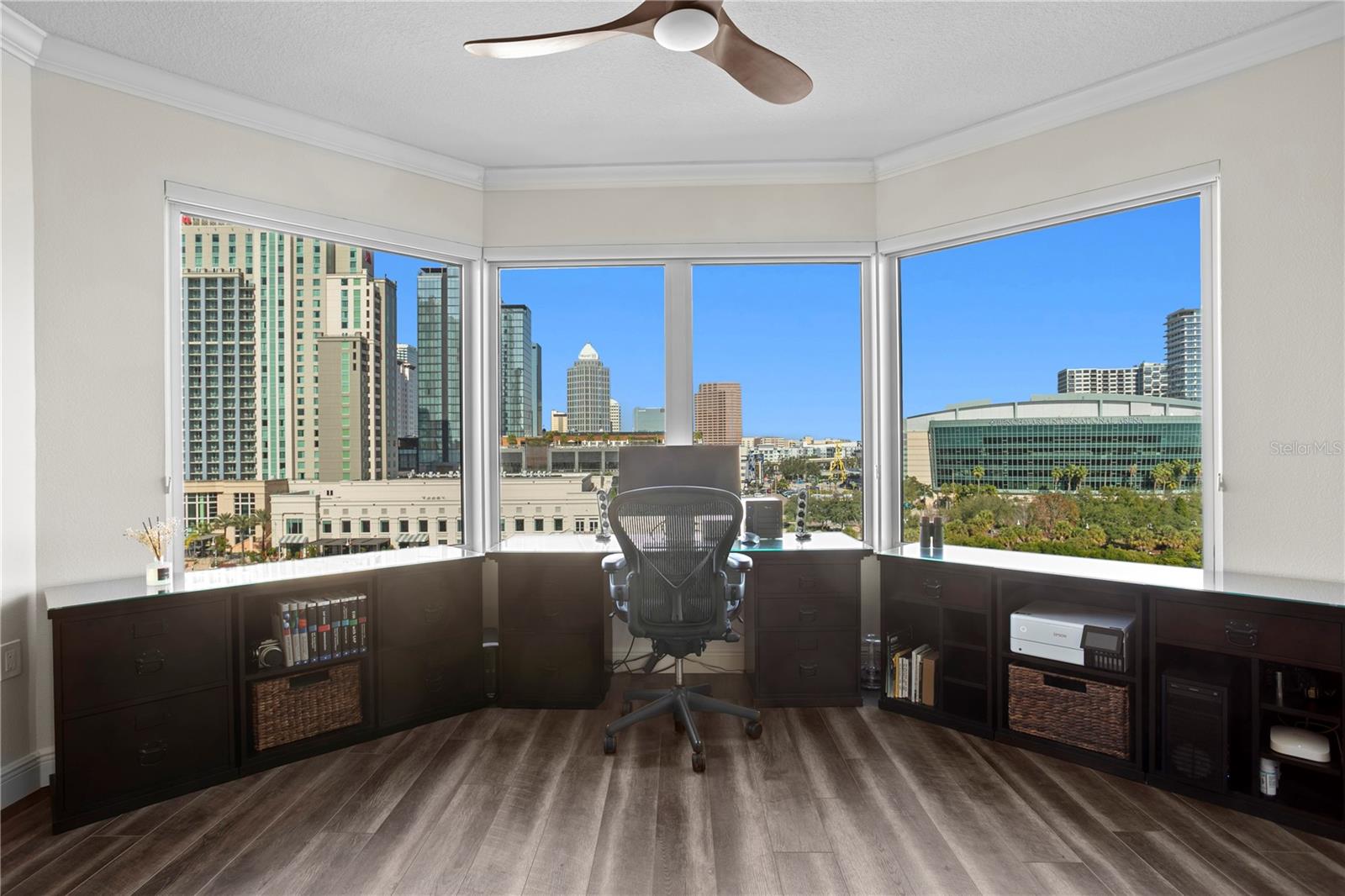 Expansive windows and sliding glass doors frame stunning views in every direction, filling the home with natural light and allowing you to watch cruise ships glide in and out of Port Tampa Bay.
