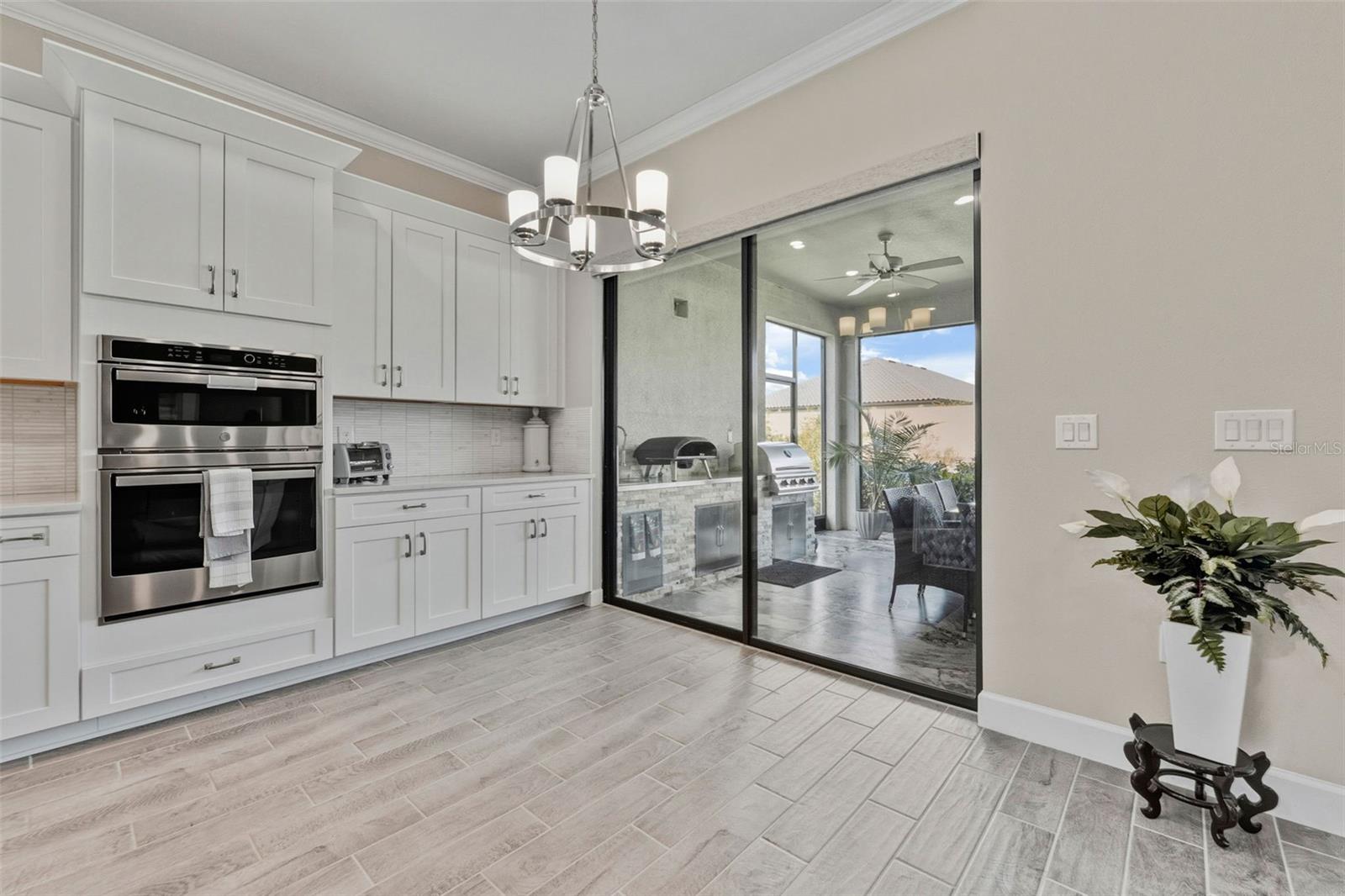 Upgraded and expanded cabinets and counters in the kitchen offer a chef ample space to cook and share their dishes.