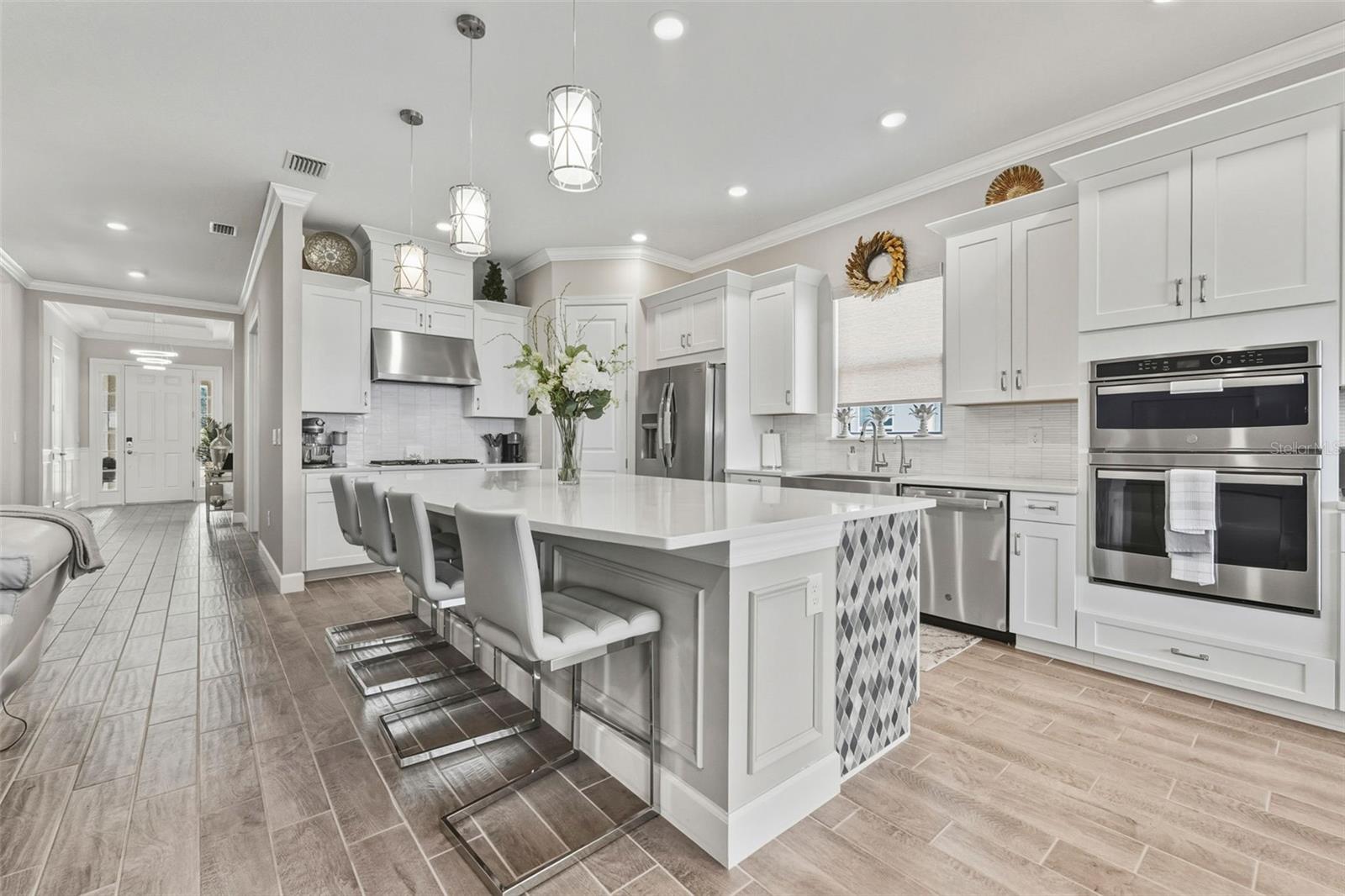 The custom finishes from the entry to the living area give great personality to this home!