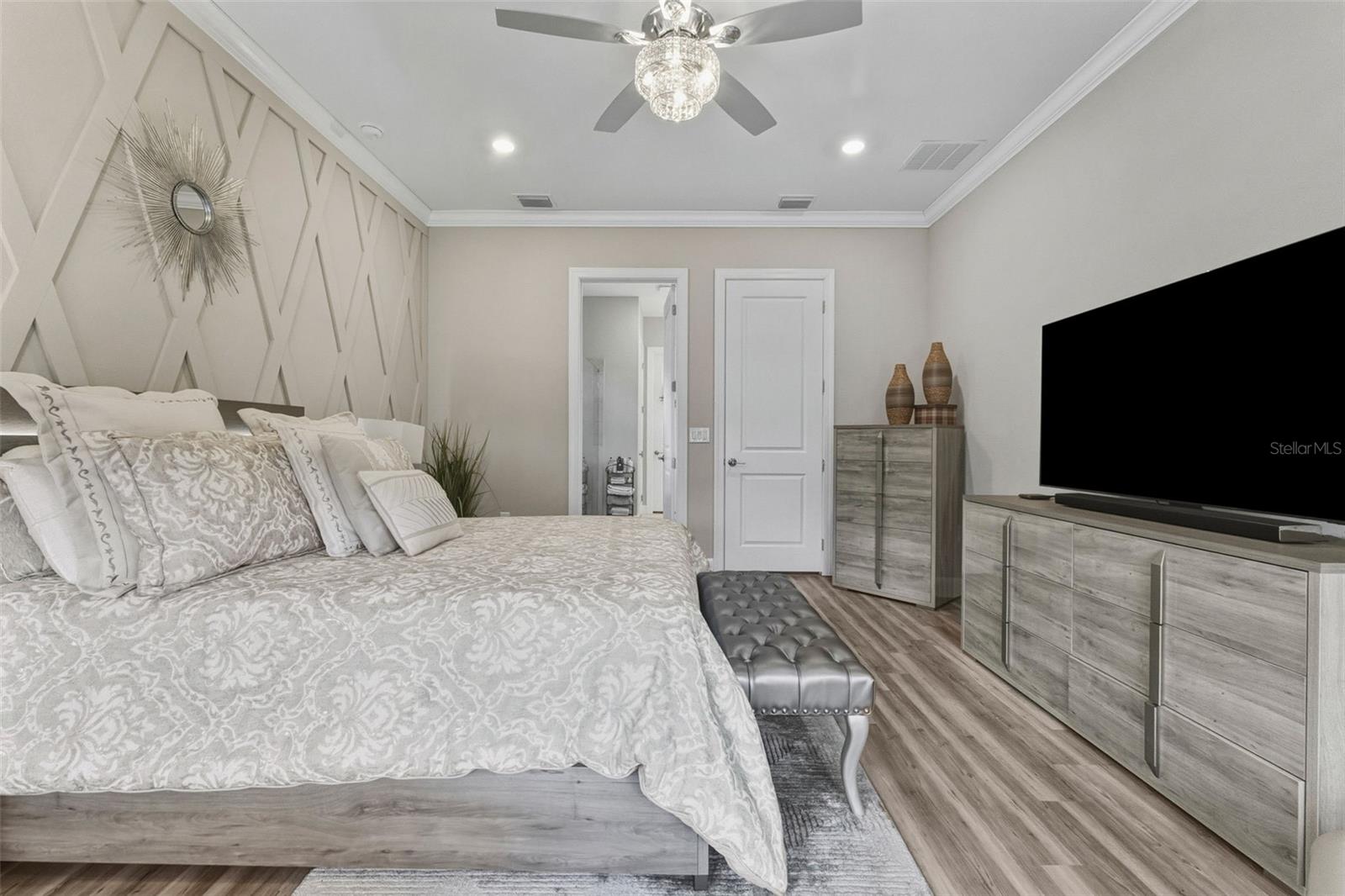 This is another view in the primary bedroom, looking toward the primary bathroom.