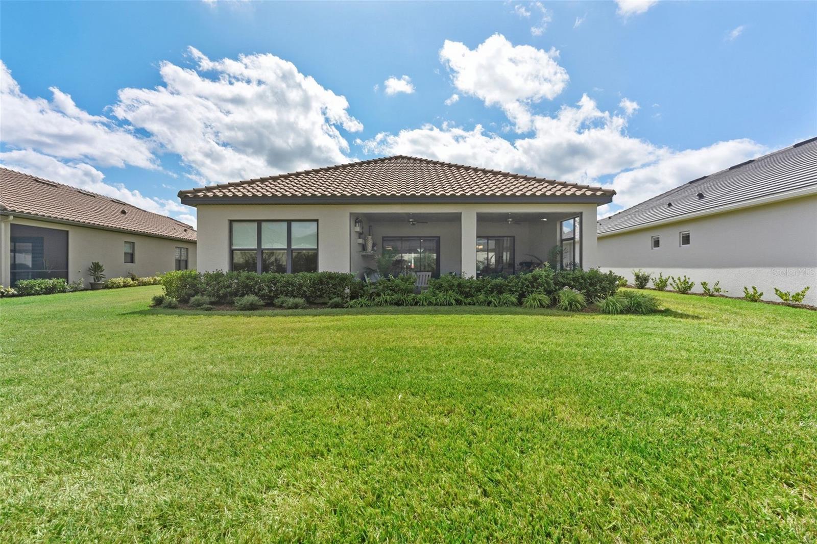 The back view of the home shows the pristine living environment provided in the community.
