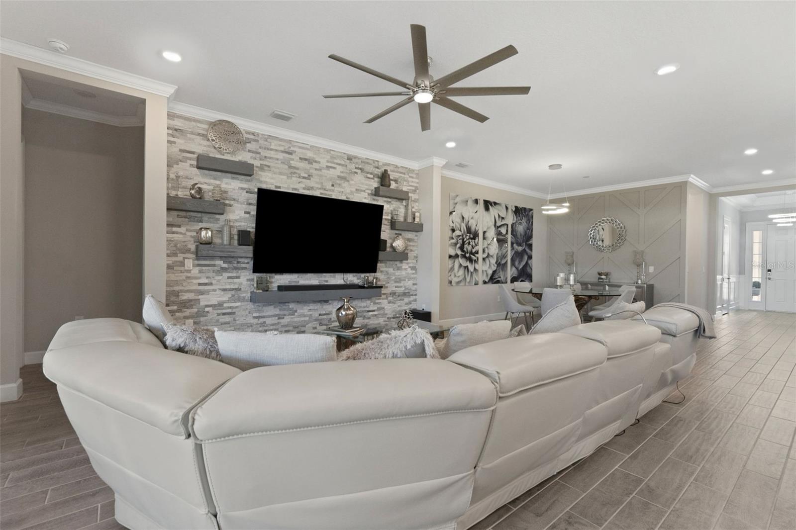 The combination living/dining area is customized with contemporary design.