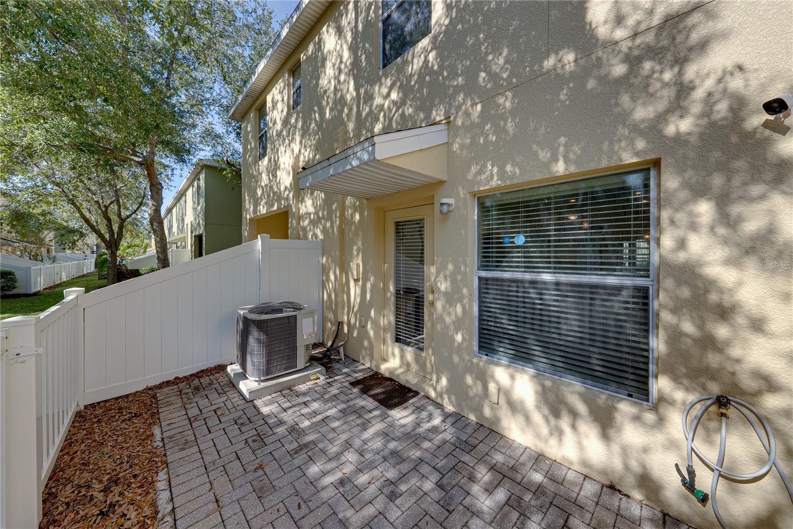 Fenced Pavered Back Yard