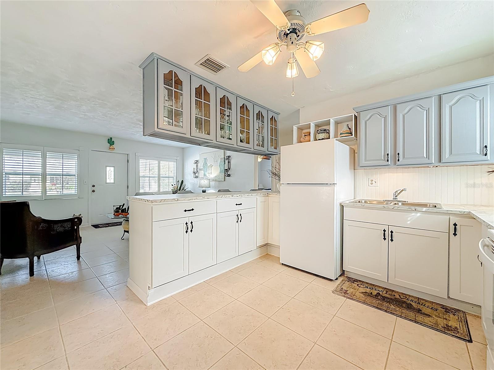 This picture shows you that the tile continues from the living room into the kitchen