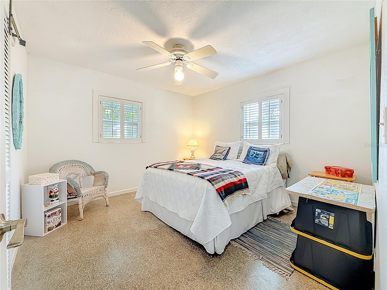 This bedroom is located in the back of the house.  It has terrazzo flooring.