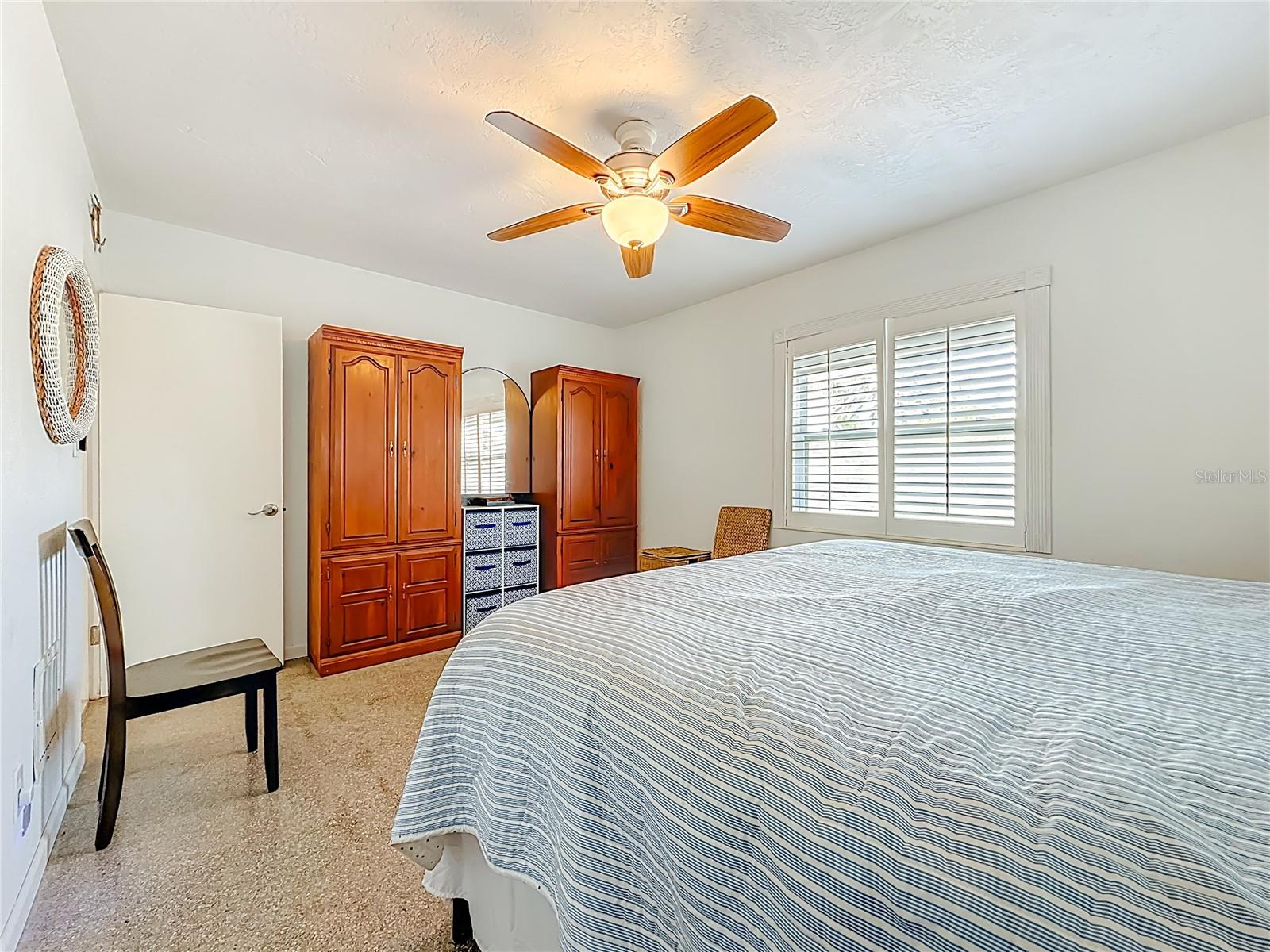 2nd view of the front bedroom that has terrazzo flooring