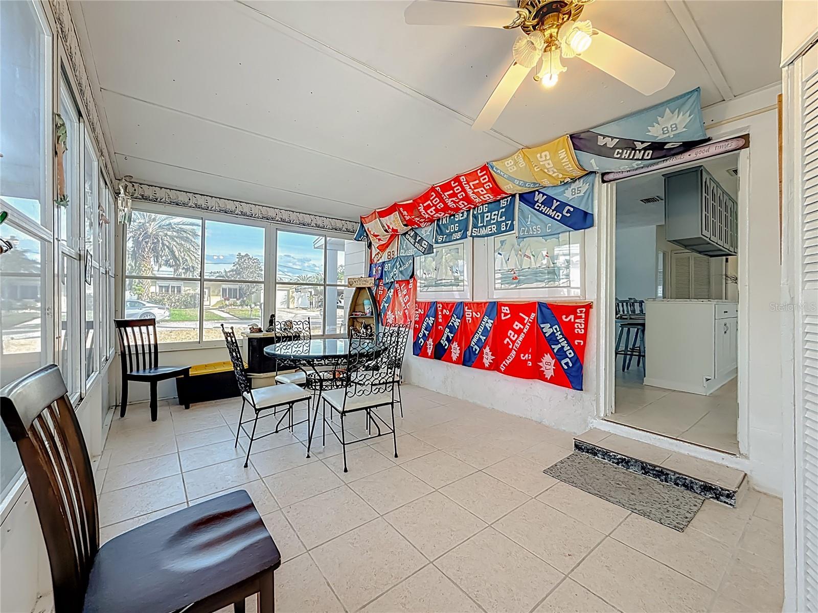 This is the enclosed side porch that offers another room for entertaining or relaxing.