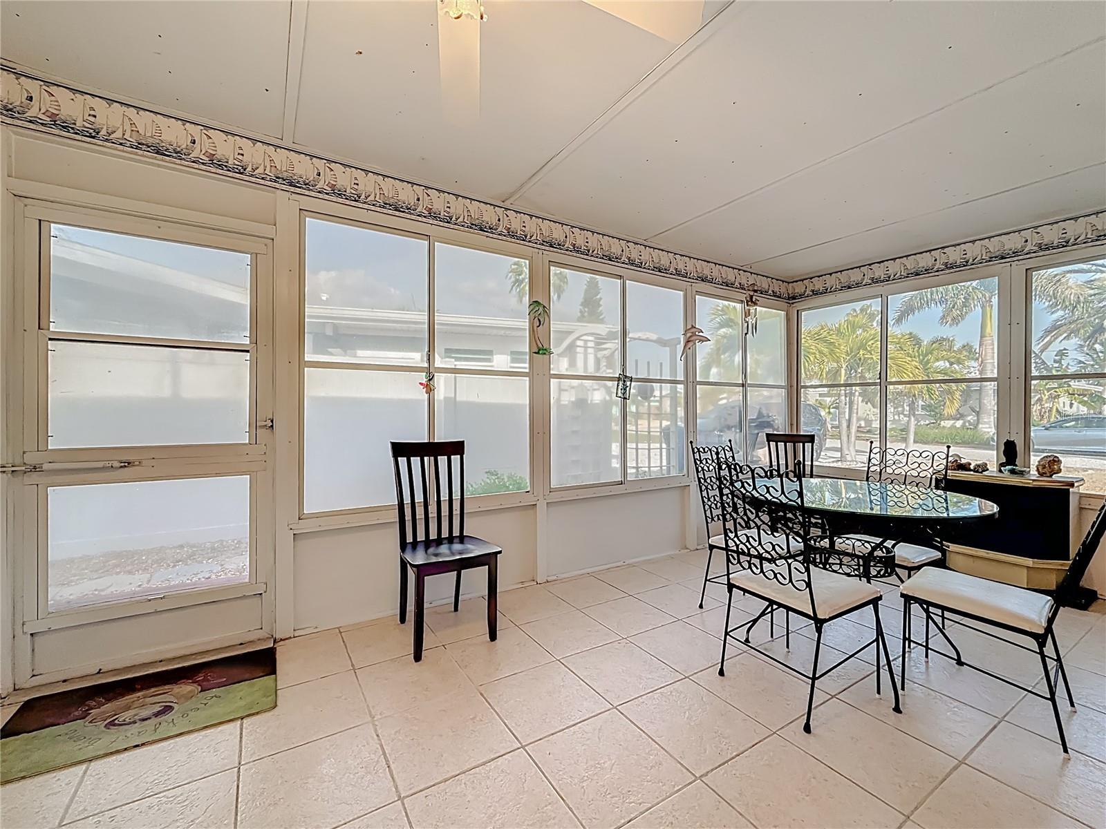 The side porch is enclosed and has screened windows that open for a nice breeze.