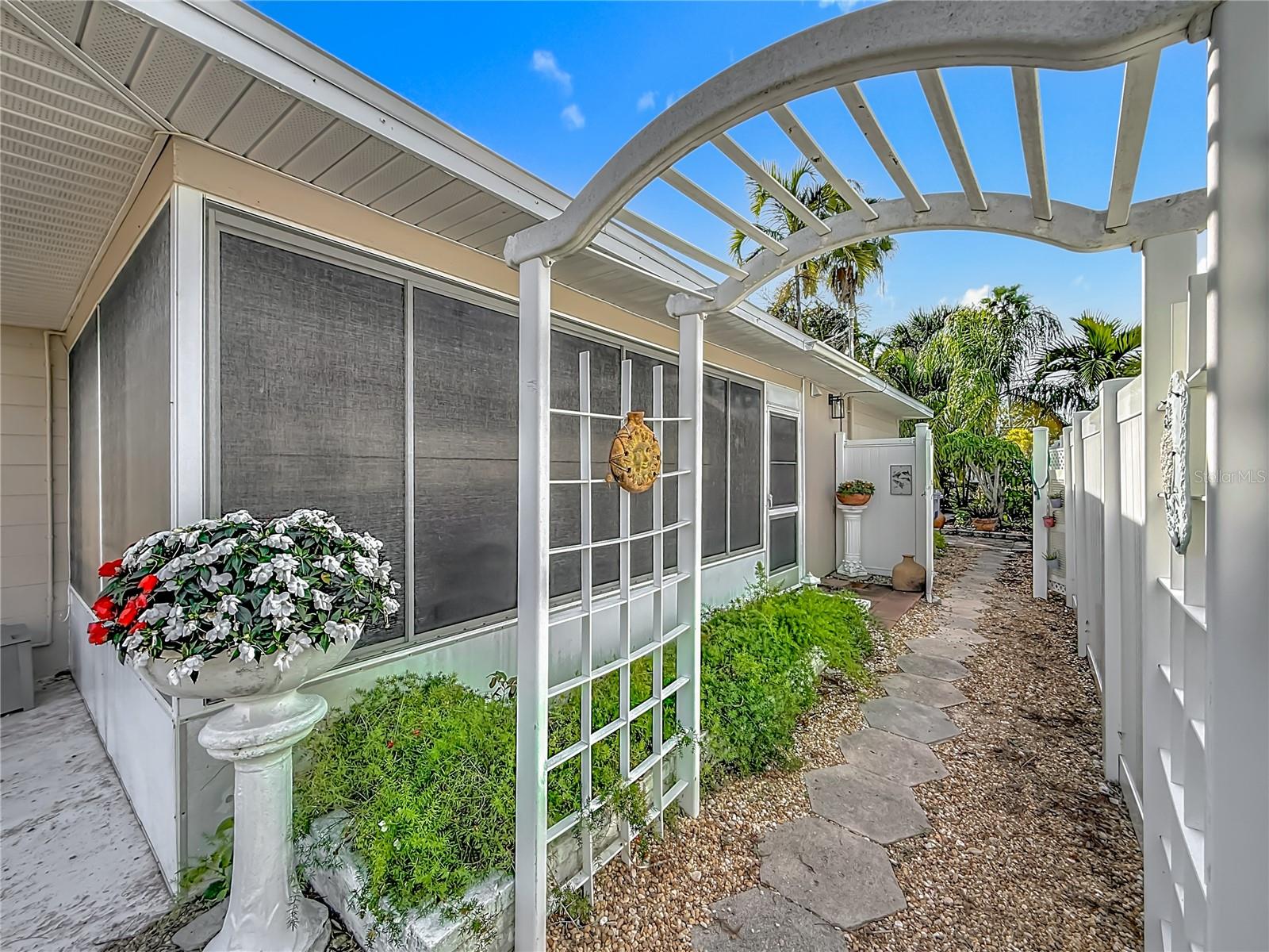 This is the walkway to the backyard - such a nice trellis welcomes everyone!