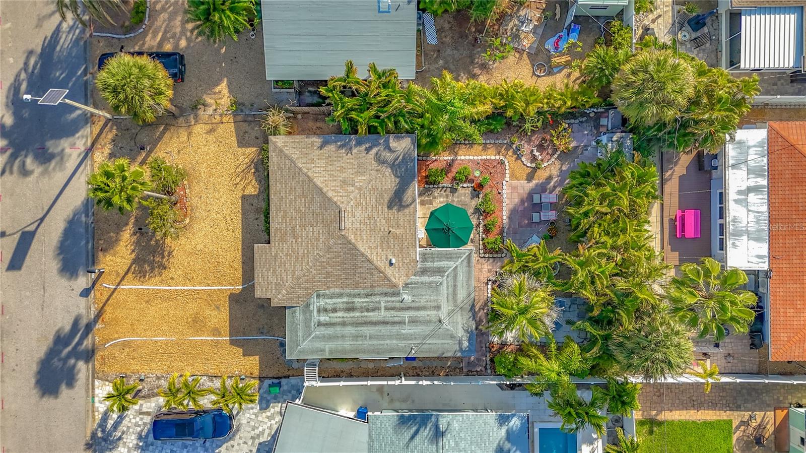 Another view of the home and the spacious backyard.  Notice all the nature privacy the backyard offers.