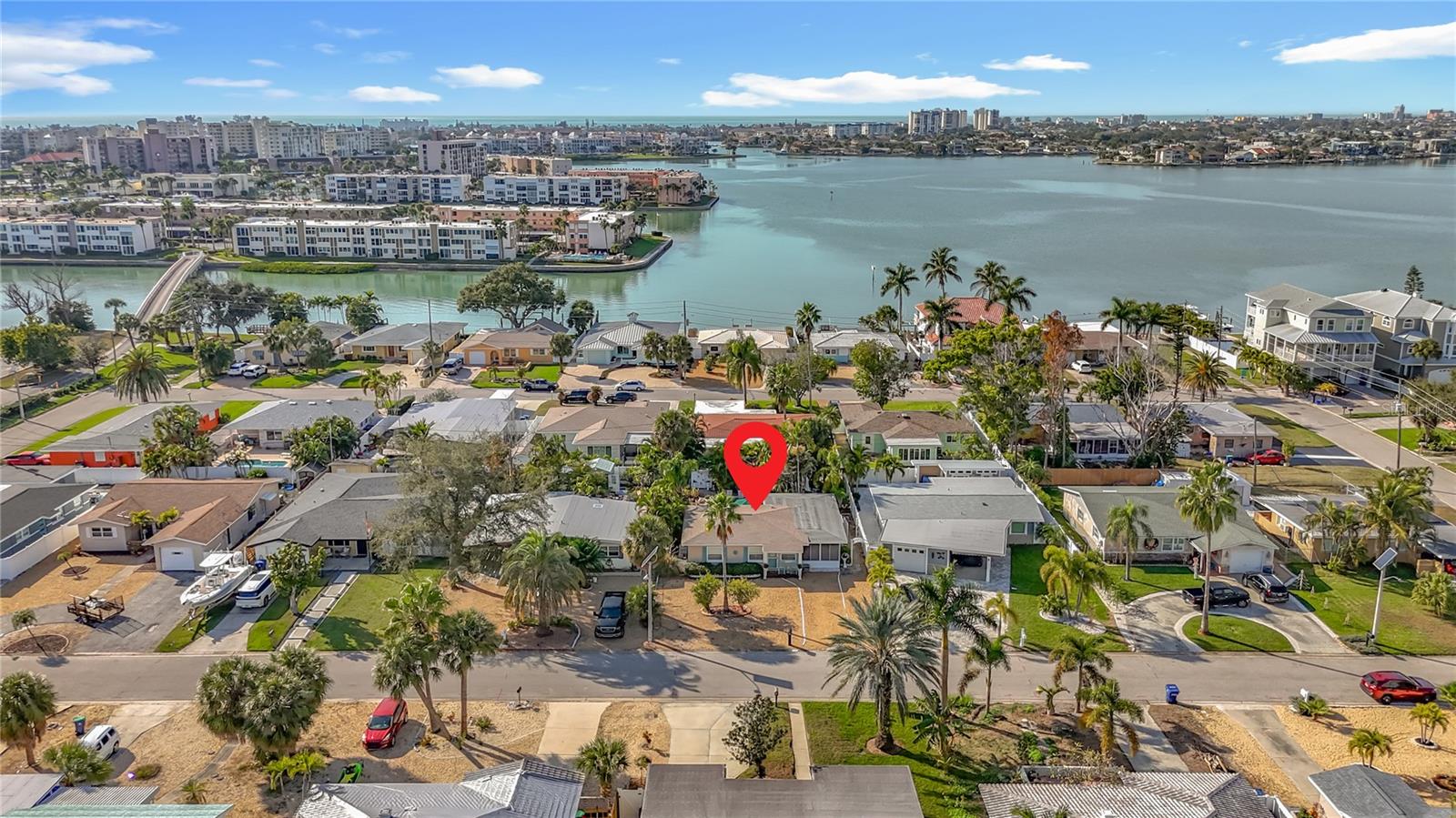 Aerial view of the home located in a neighborhood with 2 parks on the water.