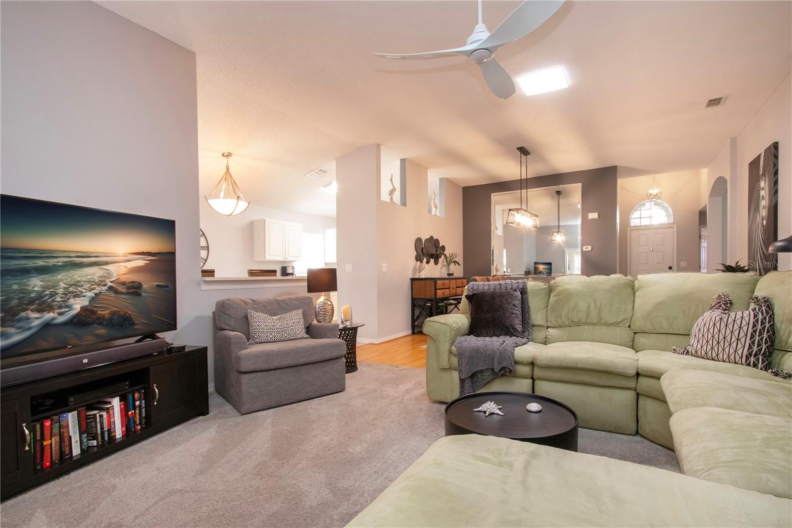 Living room with kitchen entryway