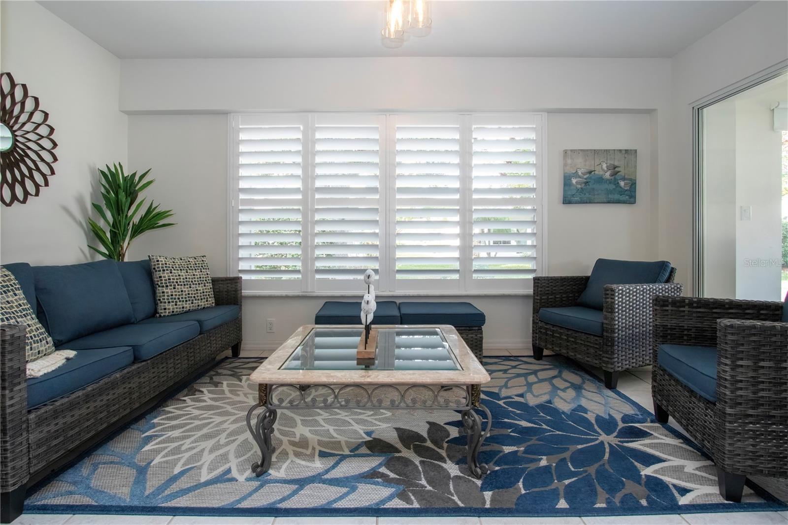 Florida room with custom plantation shutters