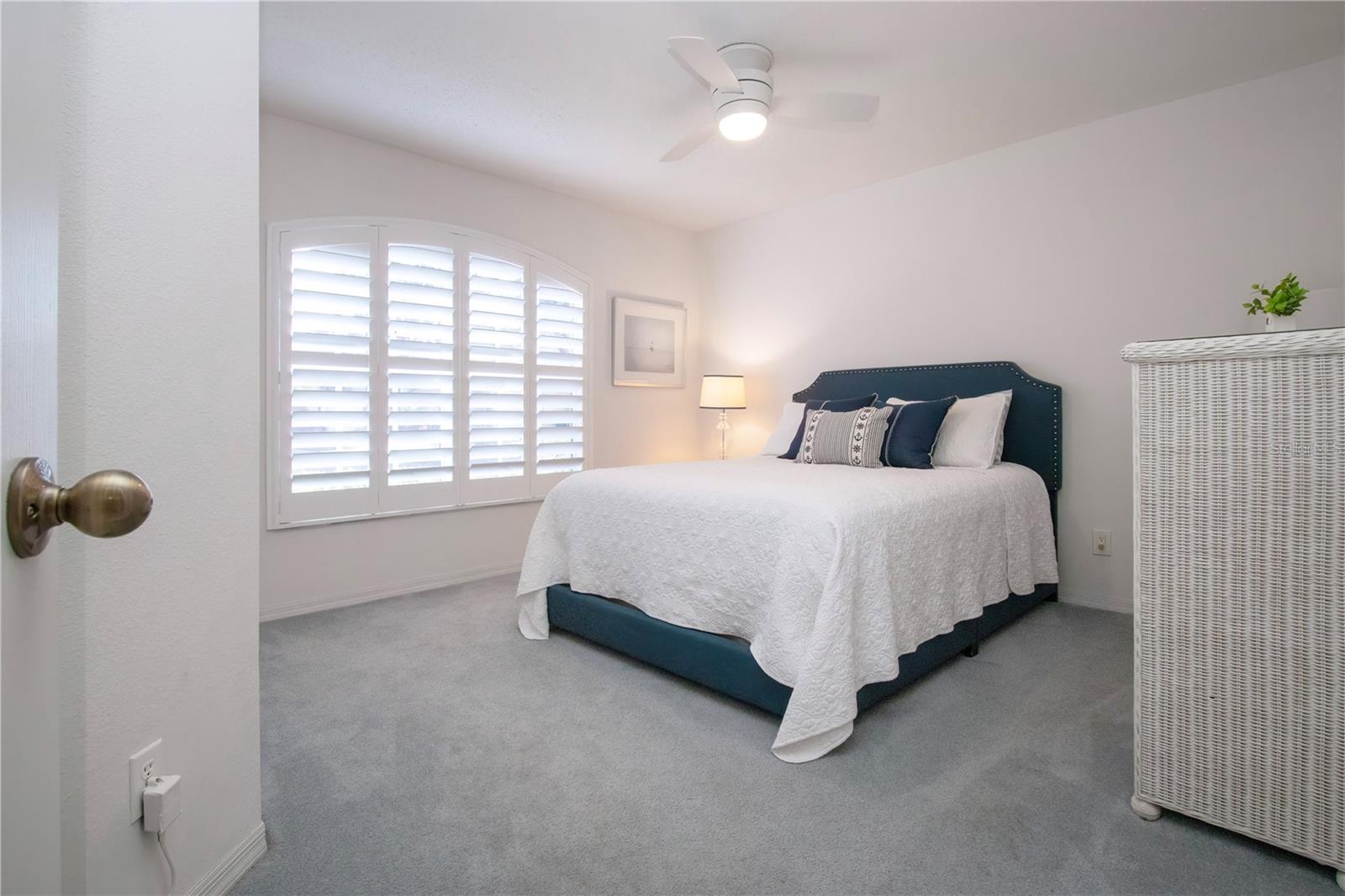 Guest bedroom with plantation shutters
