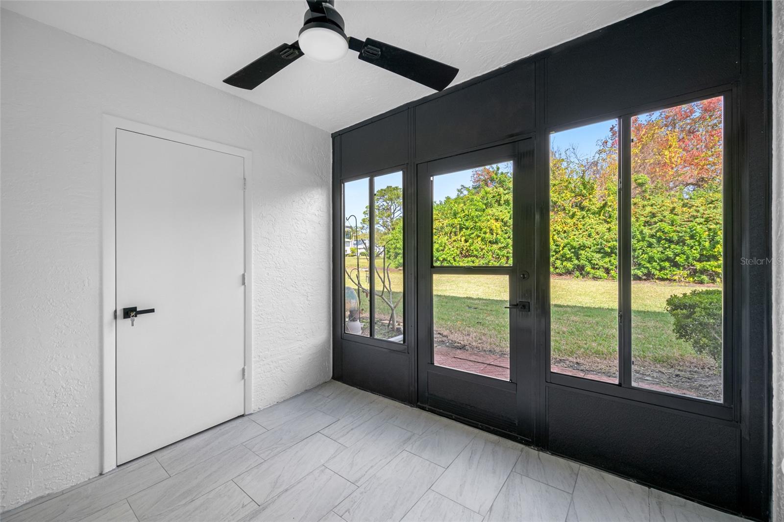 Shared lanai with green space view