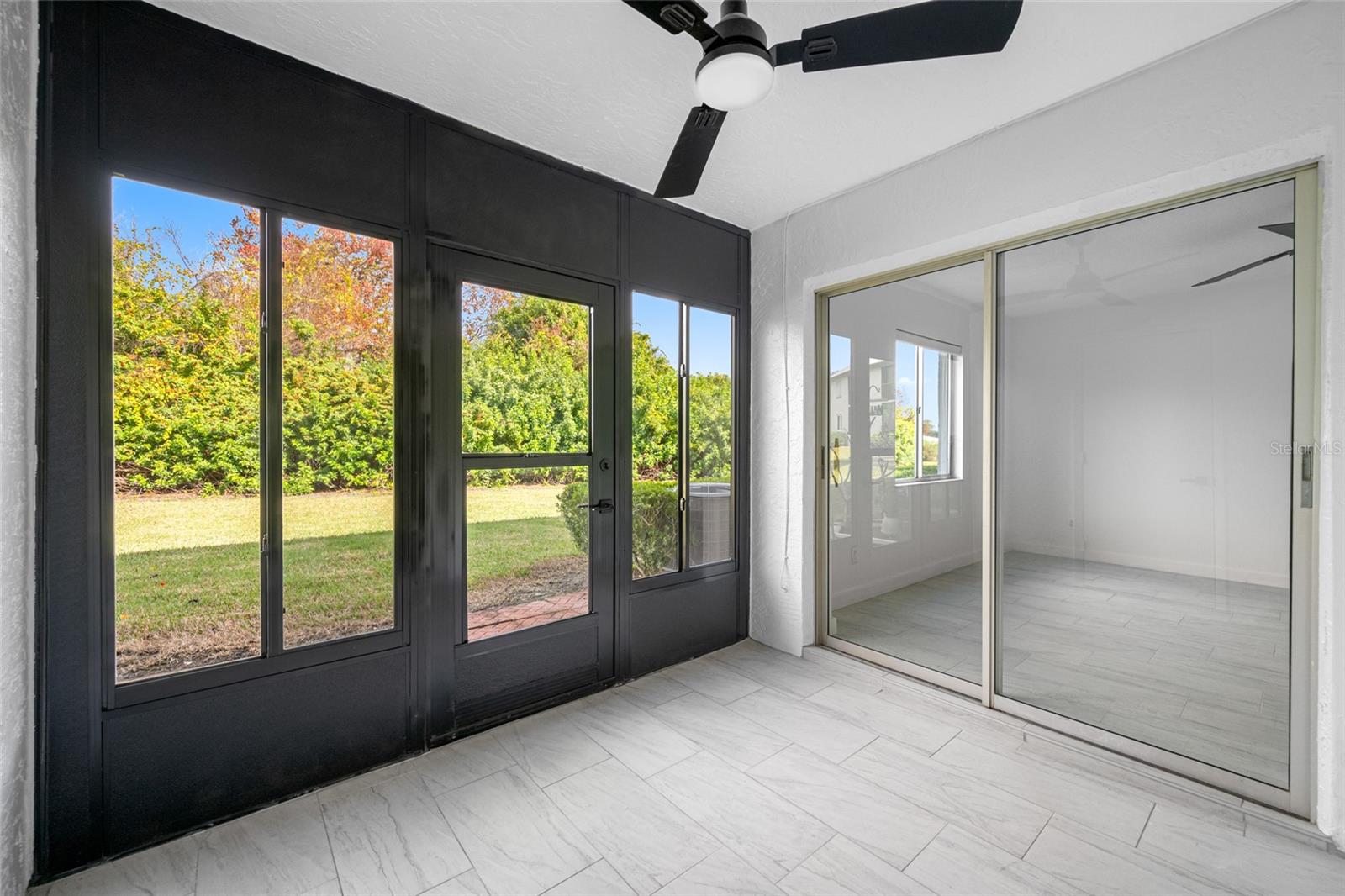 Shared lanai with green space view