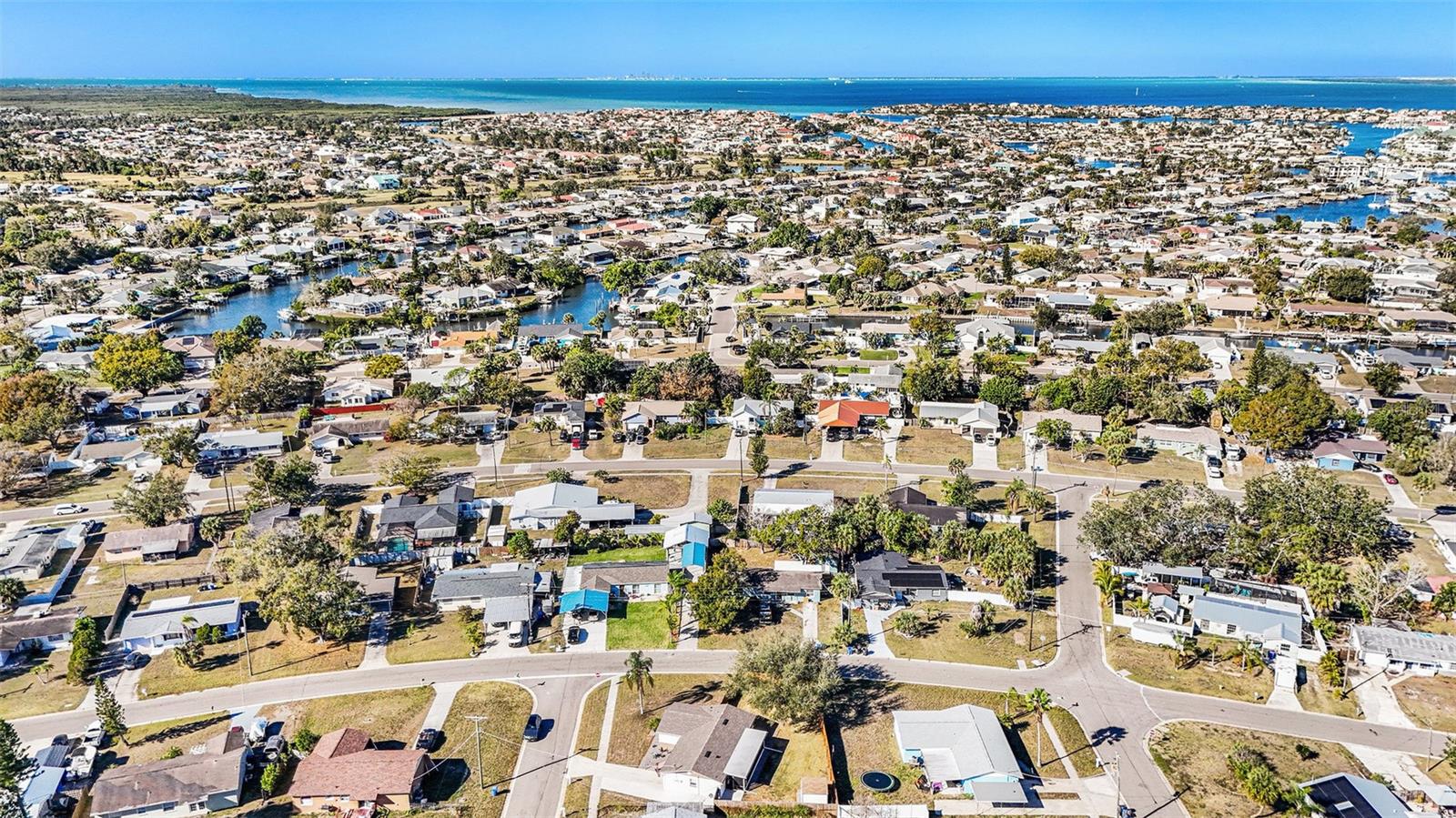 Aerial view highlighting the home’s corner-lot setting within a quiet Apollo Beach neighborhood just minutes from Tampa Bay.