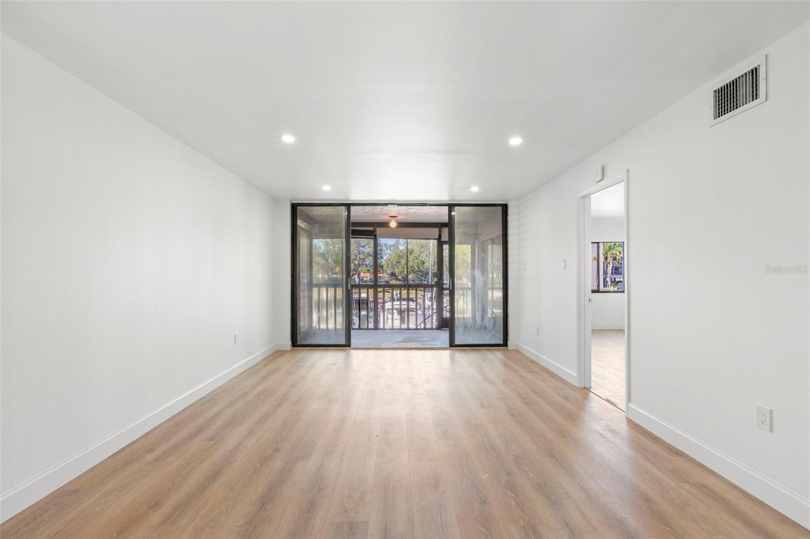 Spacious living room with beautiful new floors