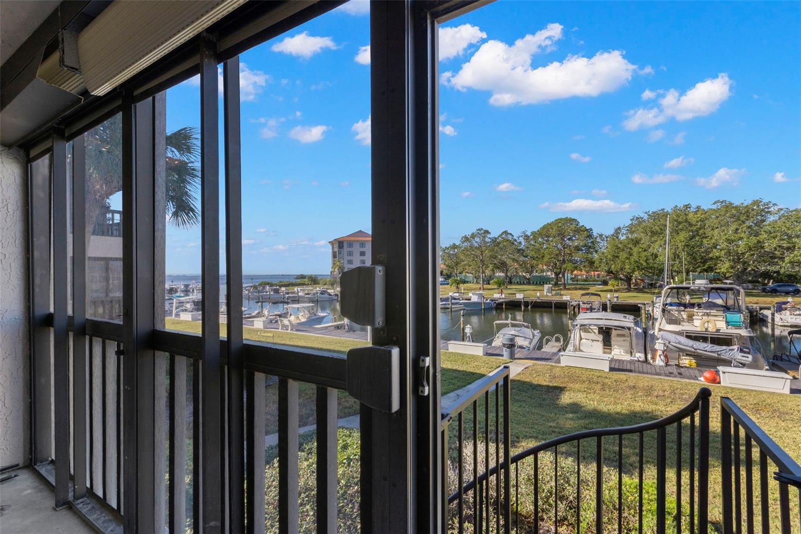 Panoramic views of the marina and Gulf from your screened in lanai