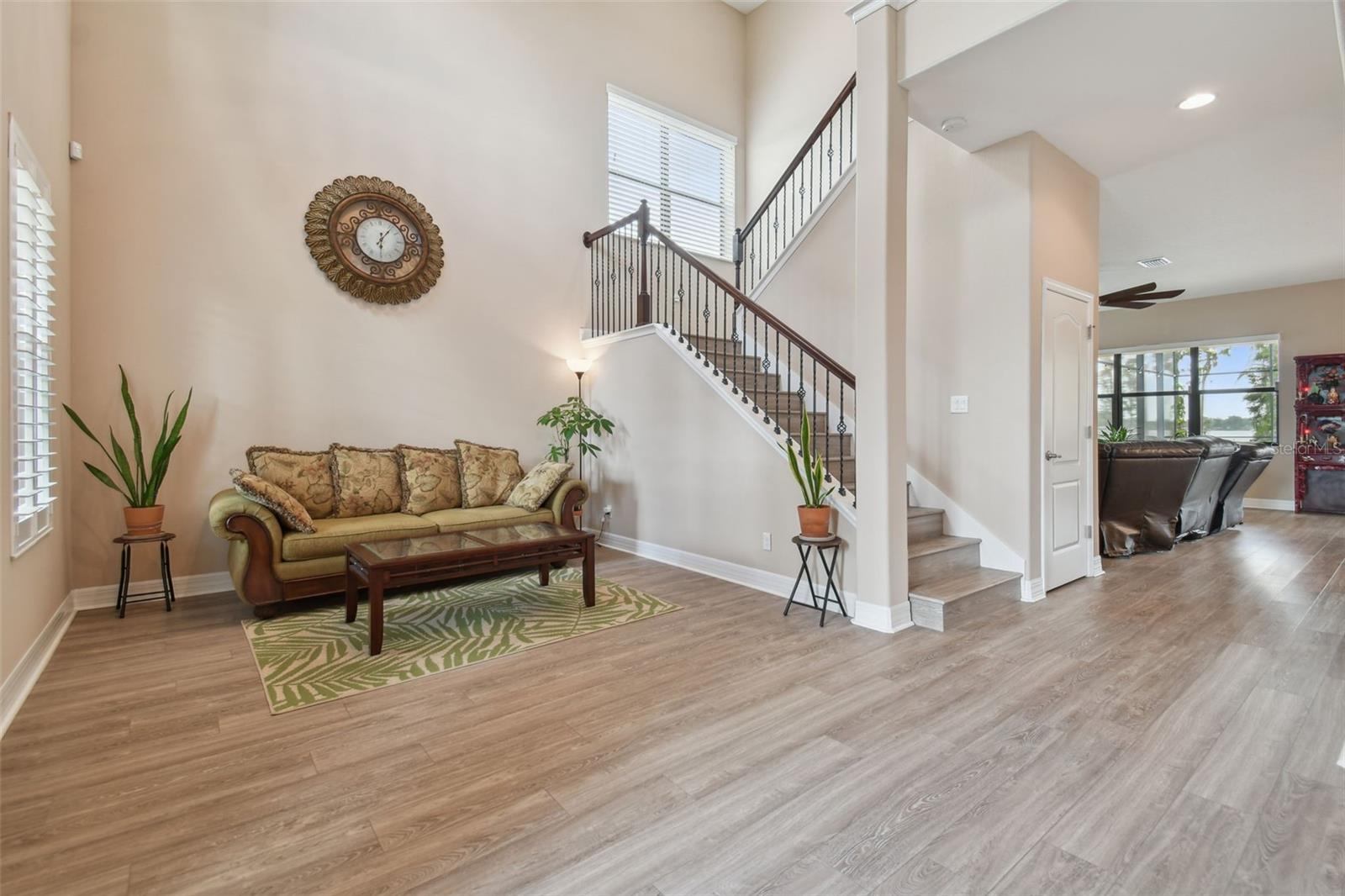 Welcome in to the expansive foyer and living room. A two-tiered stairway leads to the large second floor.