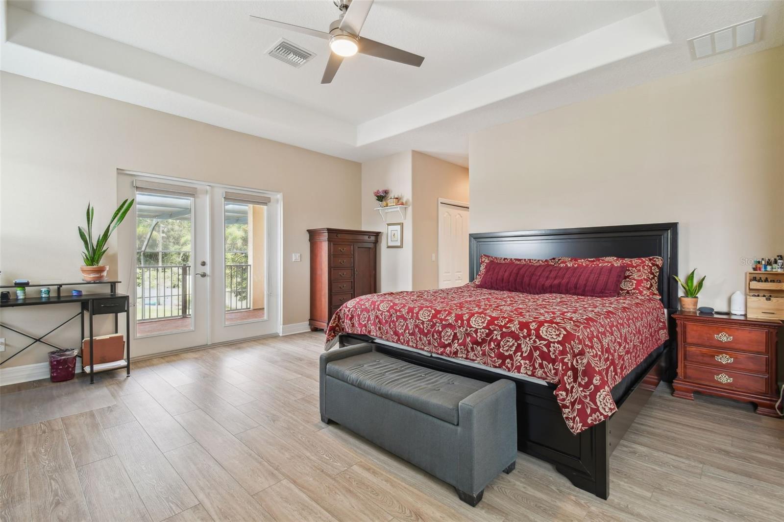 From the balcony you enter the extra-large primary bedroom.