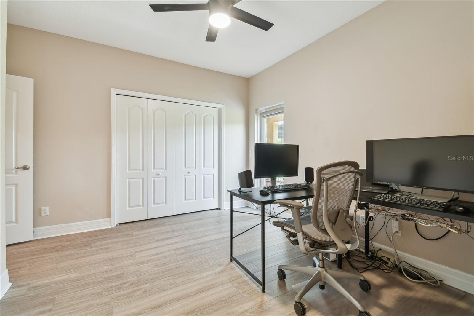 Currently used as an in-home office, this is a full bedroom.