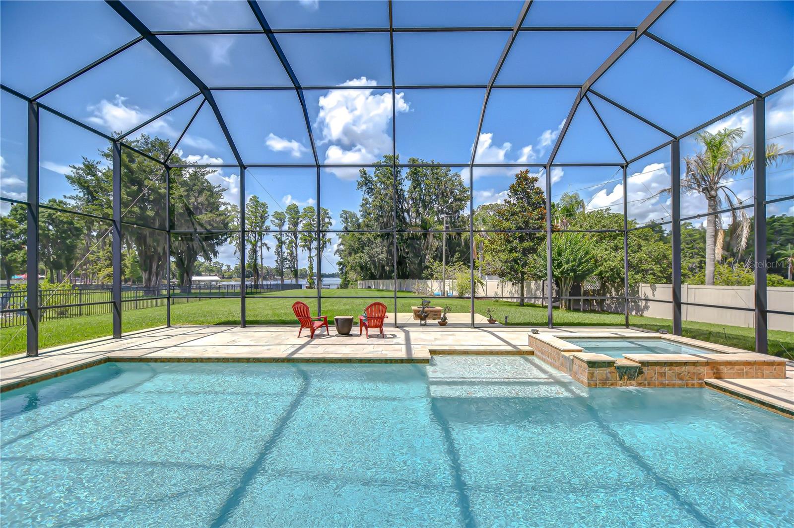 The extra large family pool with the two story screened enclosure will allow for a lot of family fun. There is also a 10 person gas heated hot tub and sun shelf.