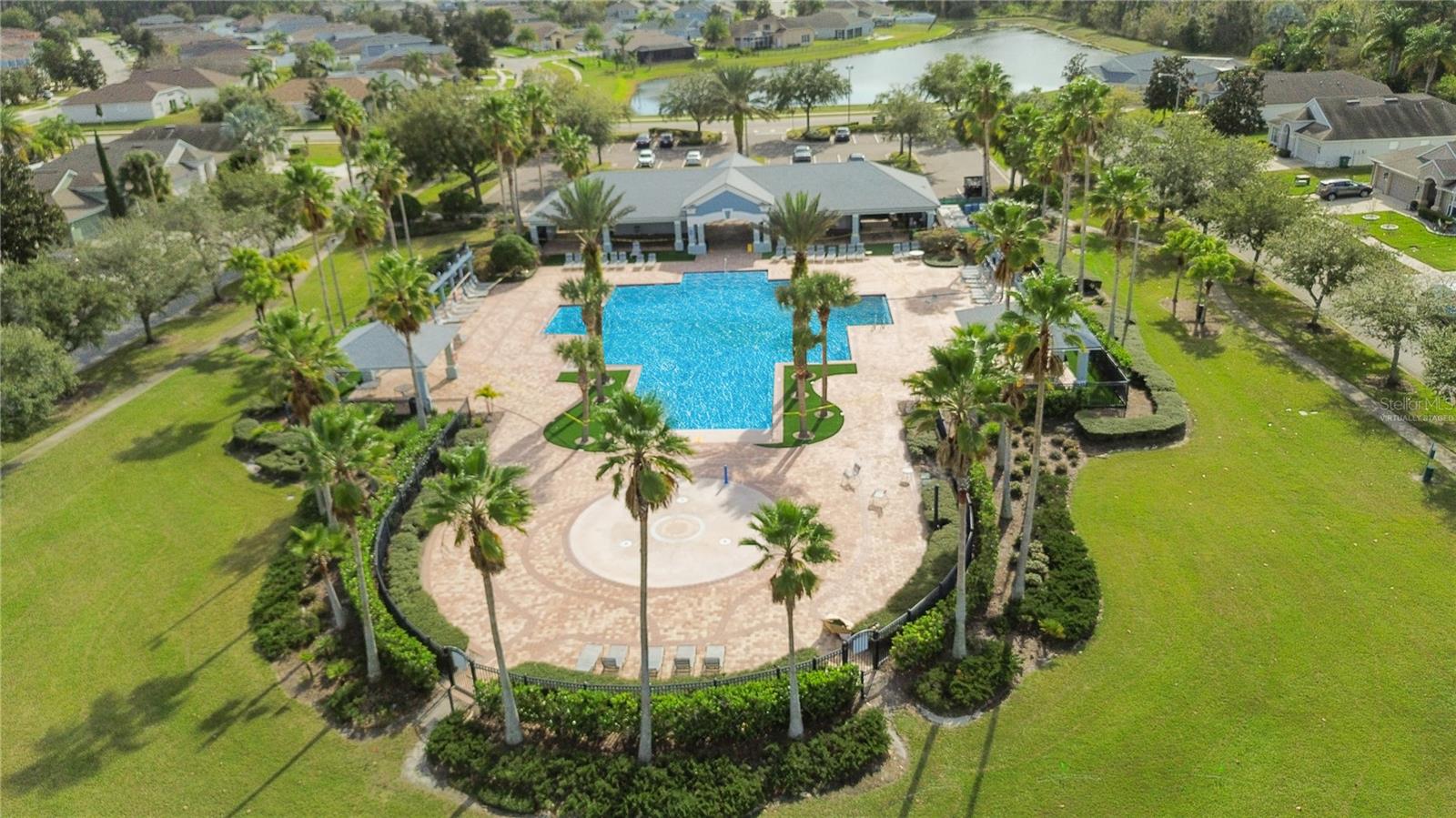 Clubhouse, Community Pool & Kids Splash Pad. Pool water is virtually staged-it is currently being worked on.