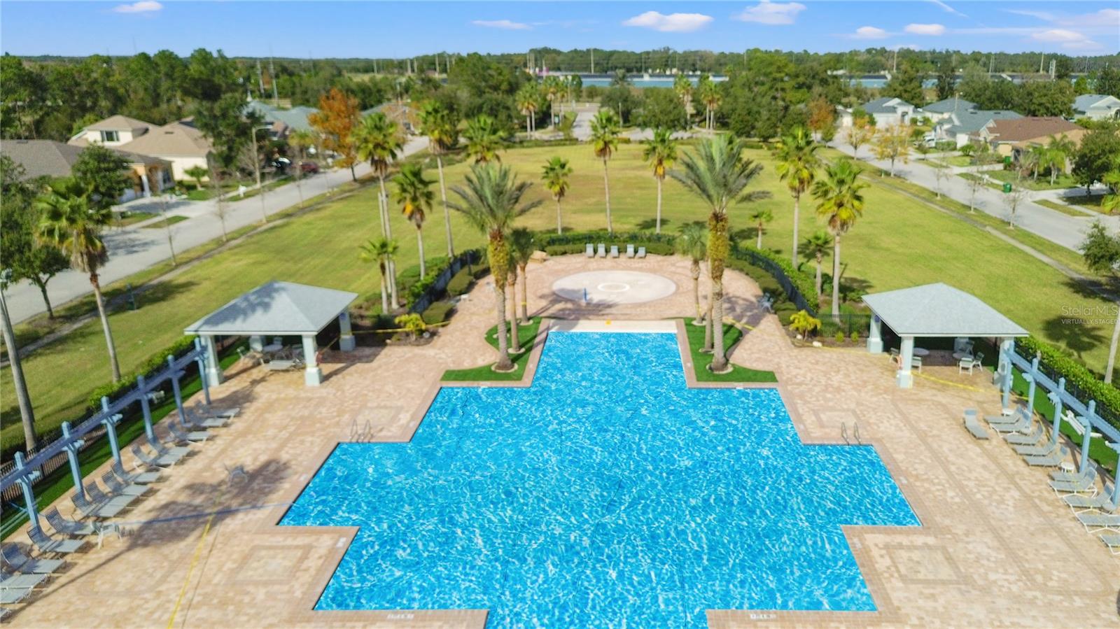 Clubhouse, Community Pool & Kids Splash Pad. Pool water is virtually staged-it is currently being worked on.
