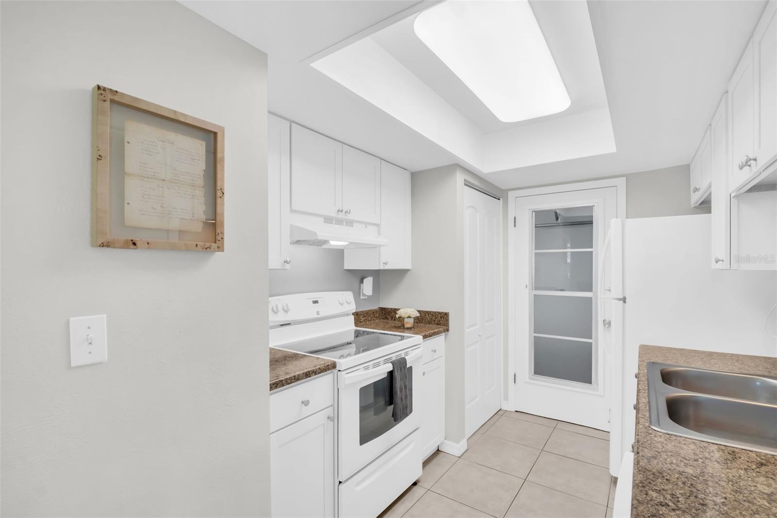 Pantry closet and newer door to the attached garage~