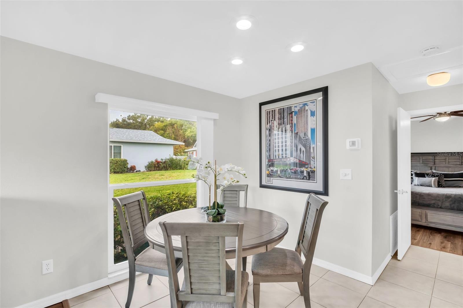 Oversized hurricane-impact windows & recessed lighting throughout~