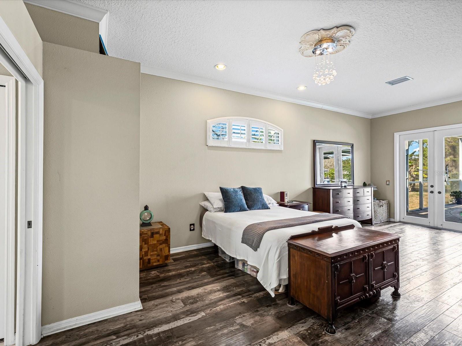 Primary Bedroom with sliding door to pool