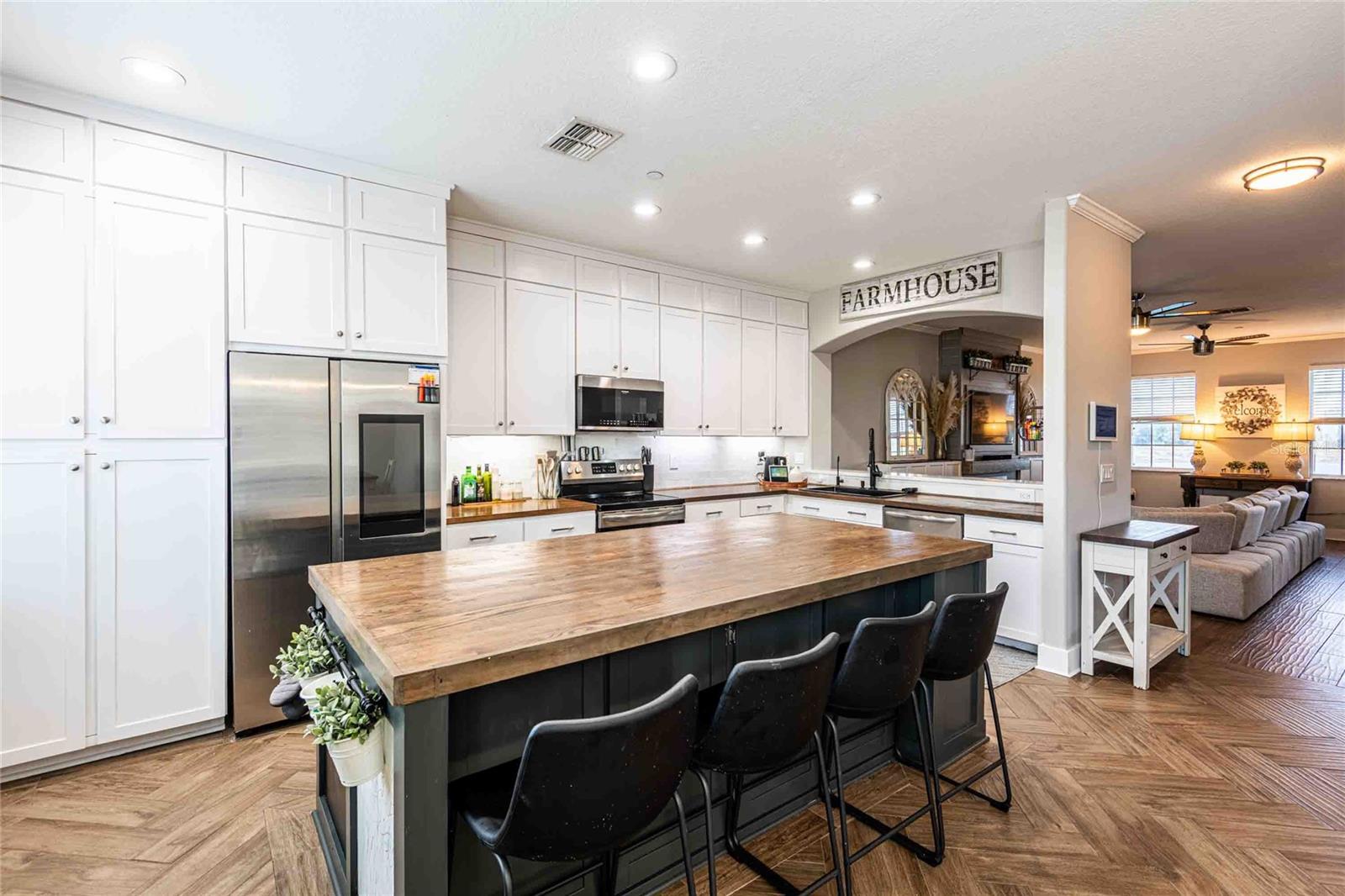 Huge center island in this upgraded kitchen