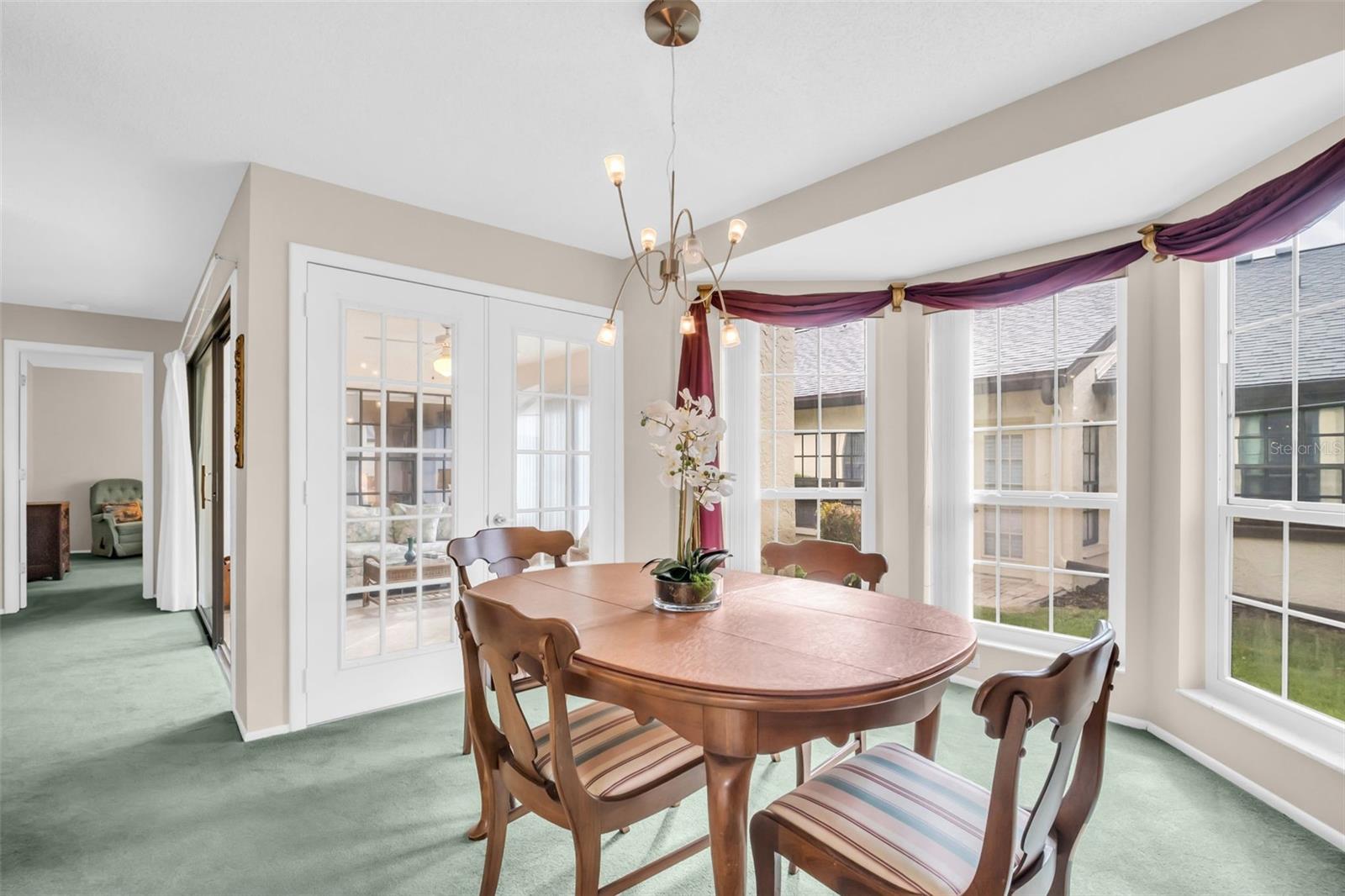 Light & bright dining room positioned between the kitchen & main living~