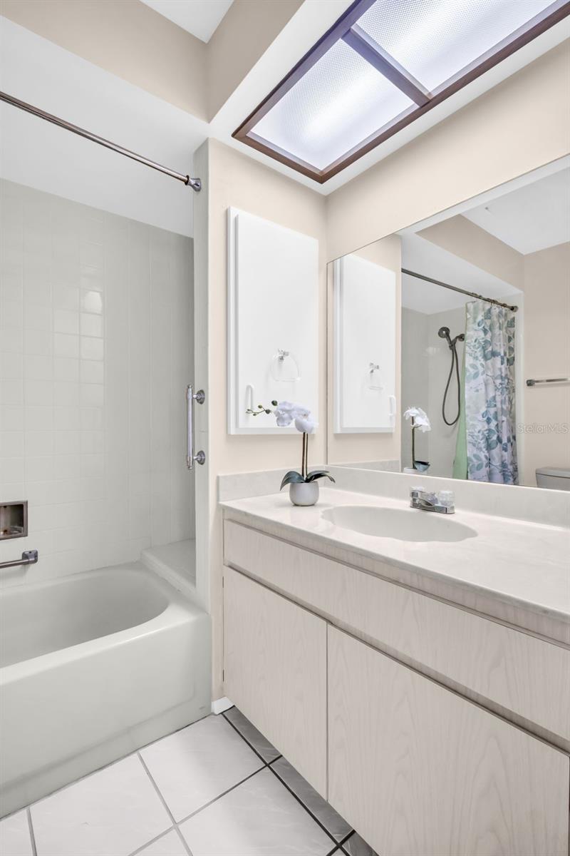 Large vanity & tub/shower combo with a built-in bench~