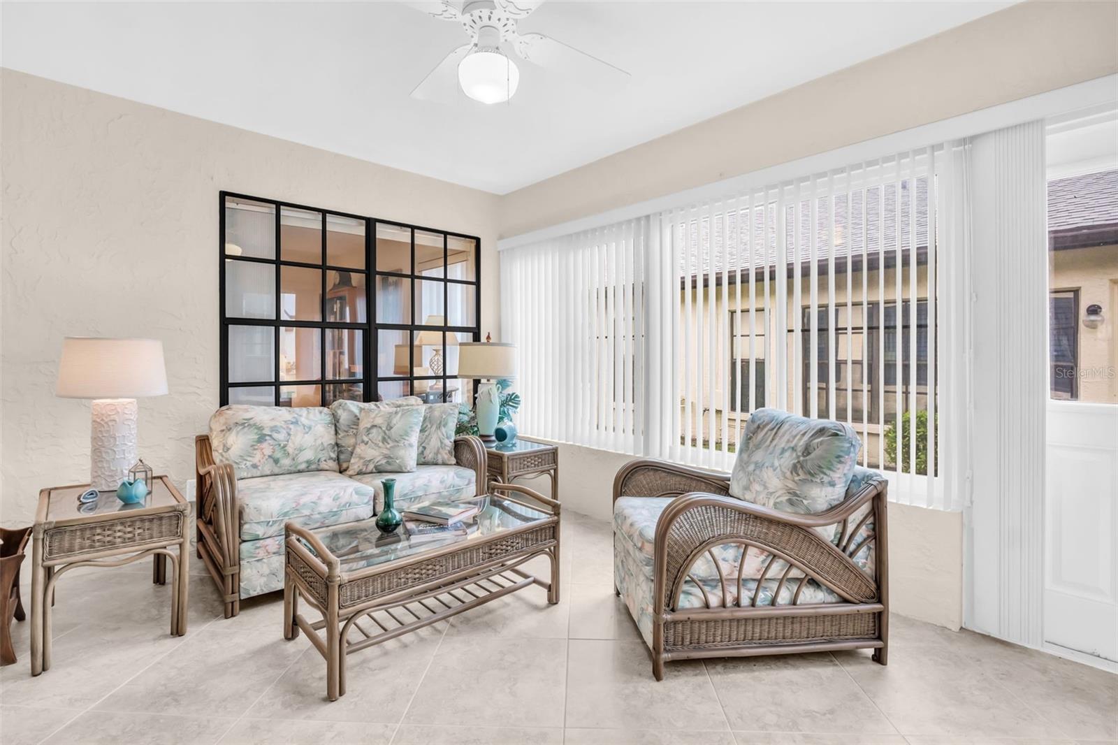 Spacious heated & cooled Florida room with updated hurricane-impact windows~