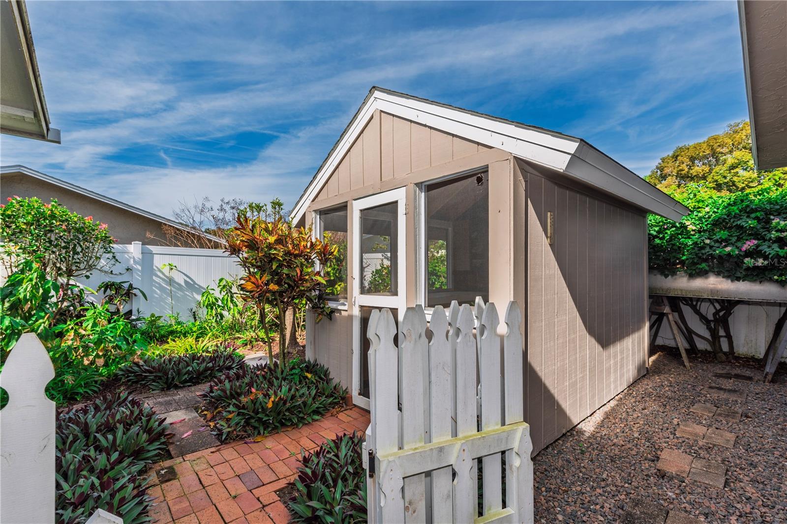 Screened she-shed and dog run.