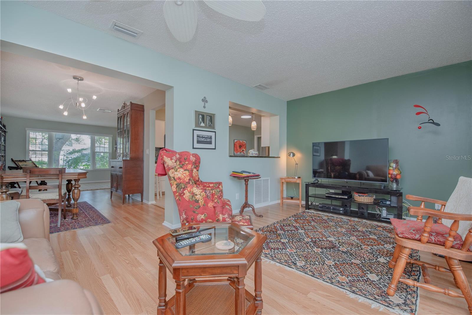 Family room has sliders to the screen lanai.