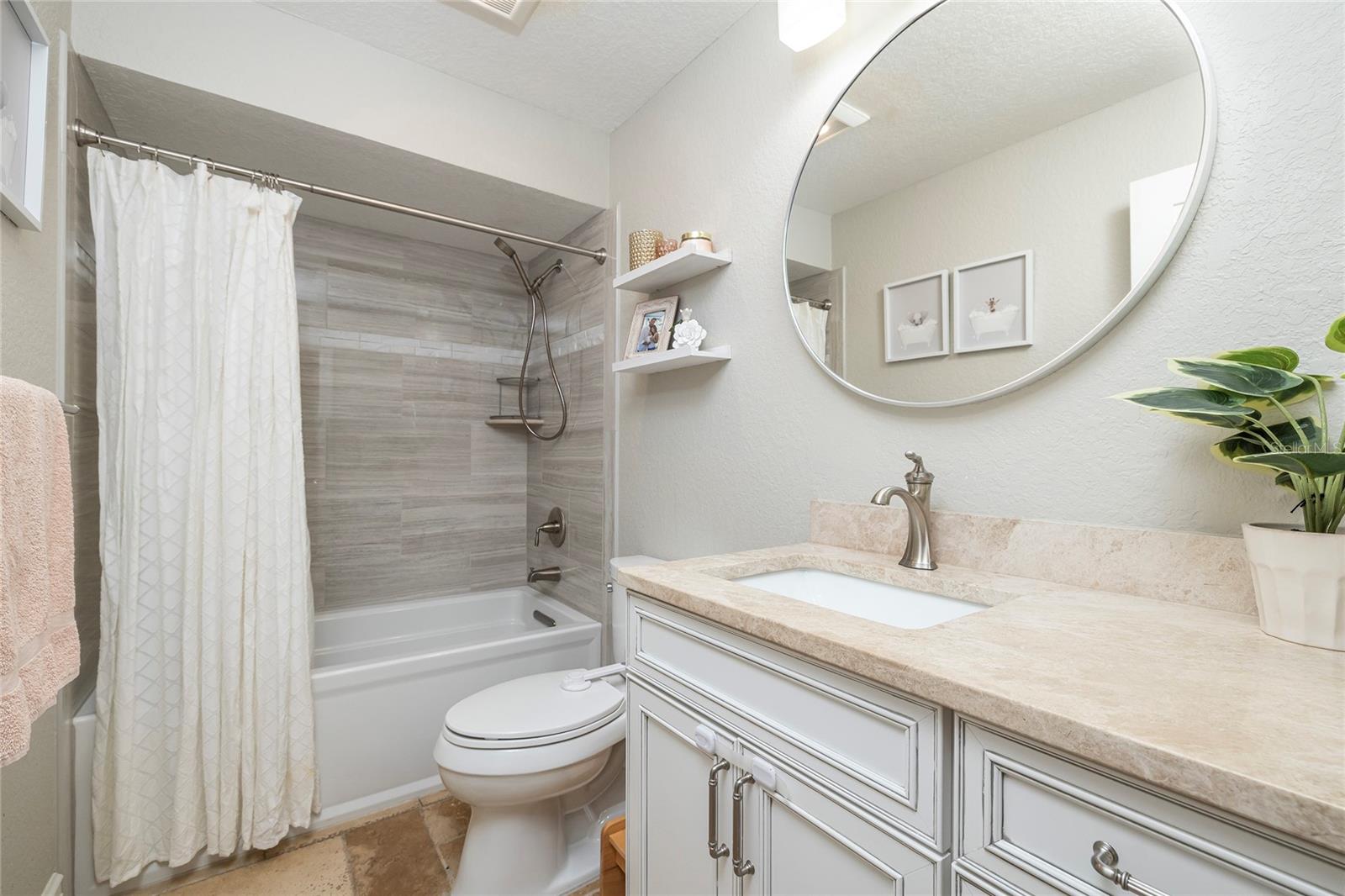 Guest Bathroom which is accessible from bedroom 3 and 4.