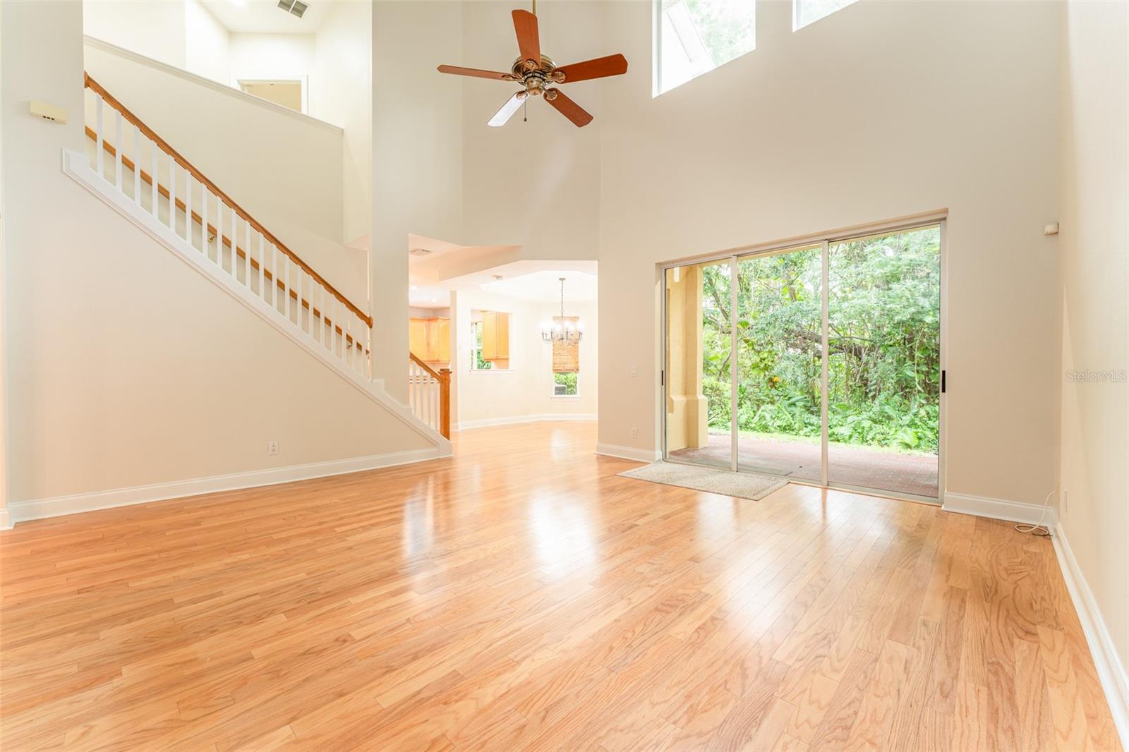 Spacious Great Room with Real Hardwood Flooring & Soaring Ceiling
