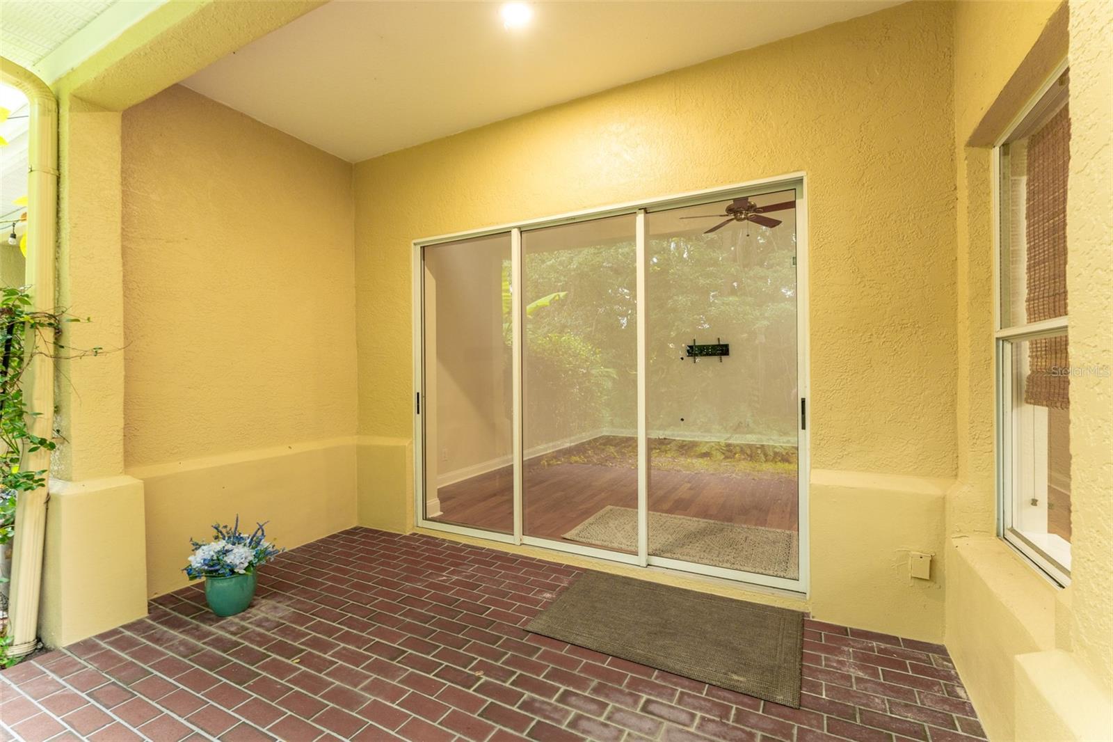 Covered Back Lania with Brick Flooring