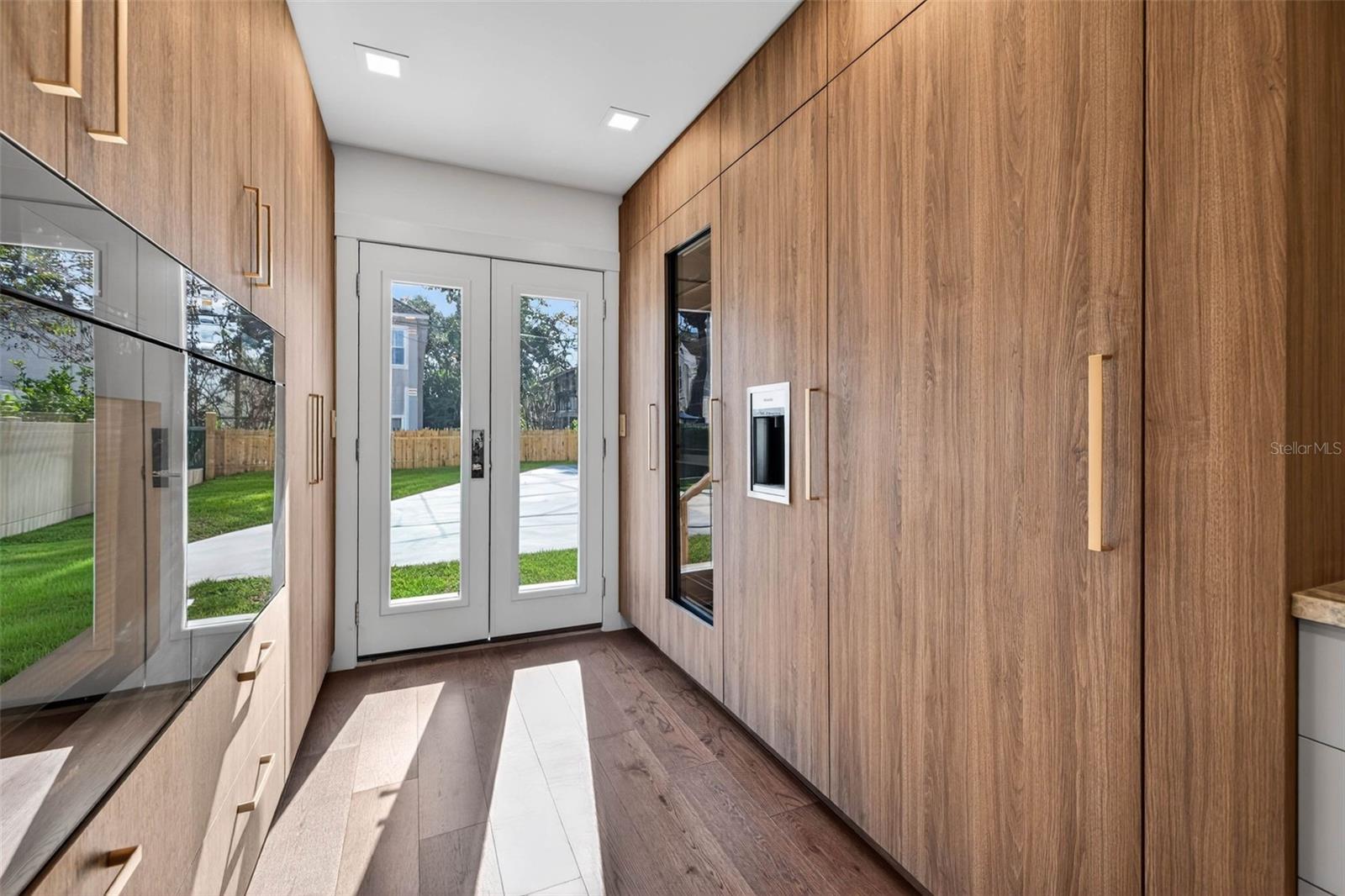 custom built Miele fridge, Miele freezer and Miele wine cooler, with pantry space, pull outs, etc.  all the details focused on