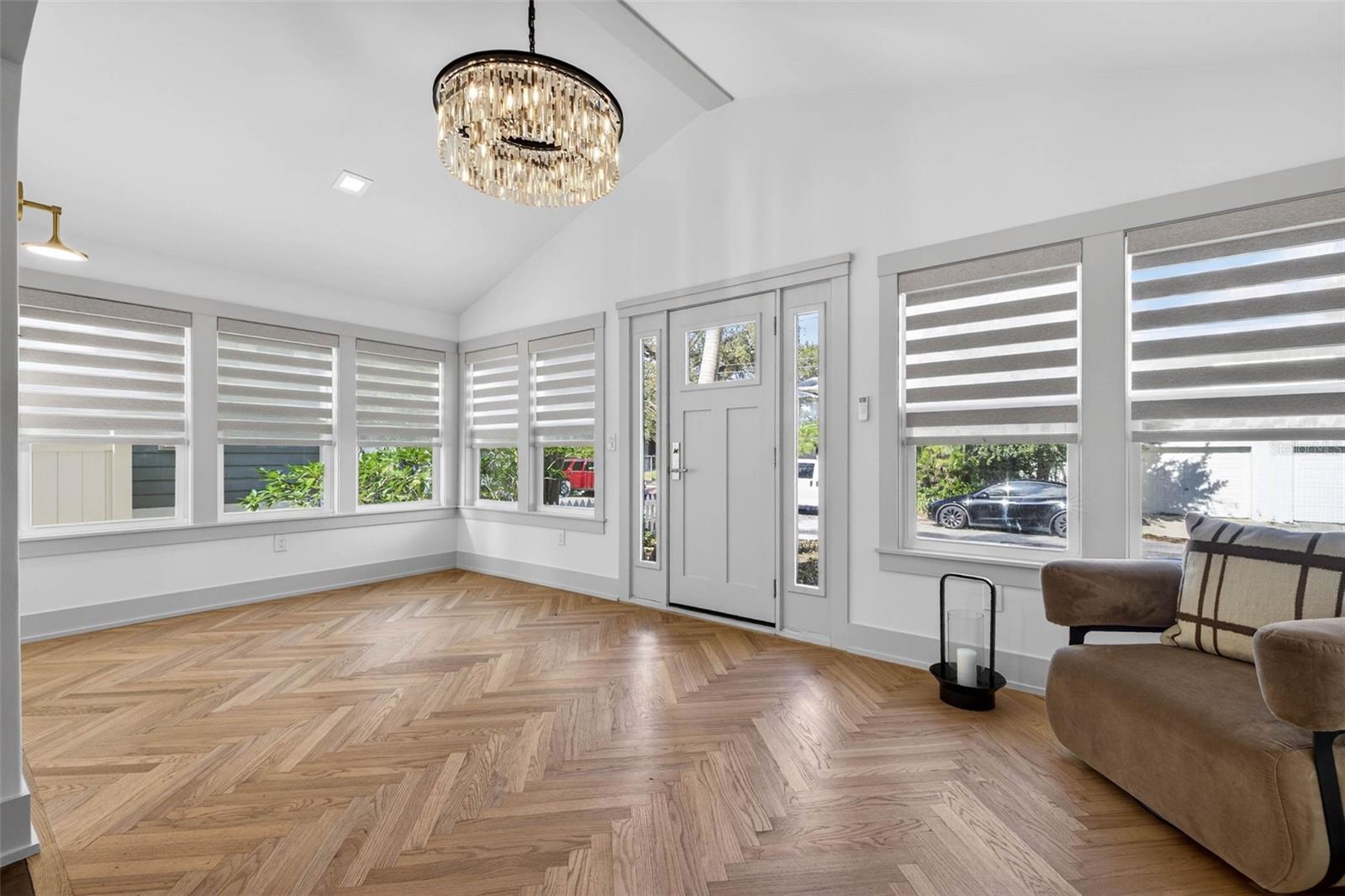 Front entrance with vaulted ceiling, custom work and designer window treatments.