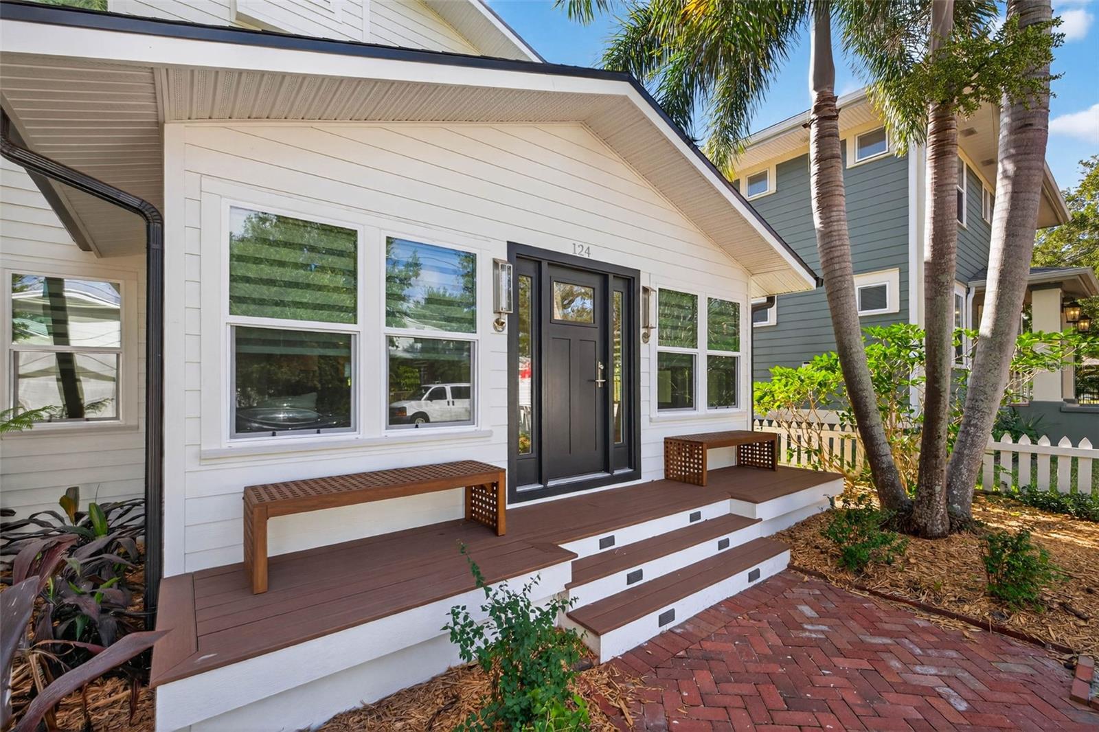 Custom built front porch benches, recessed step lighting all to accent this exceptional home